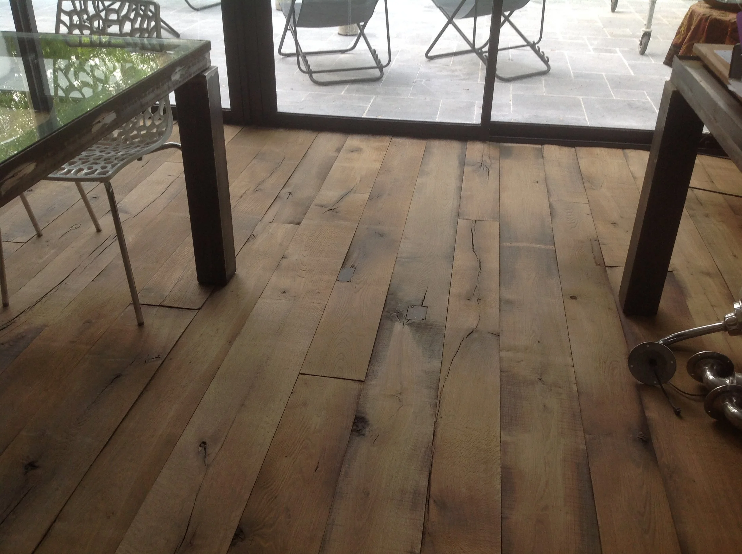 Textured reclaimed flooring with pronounced character and natural variation