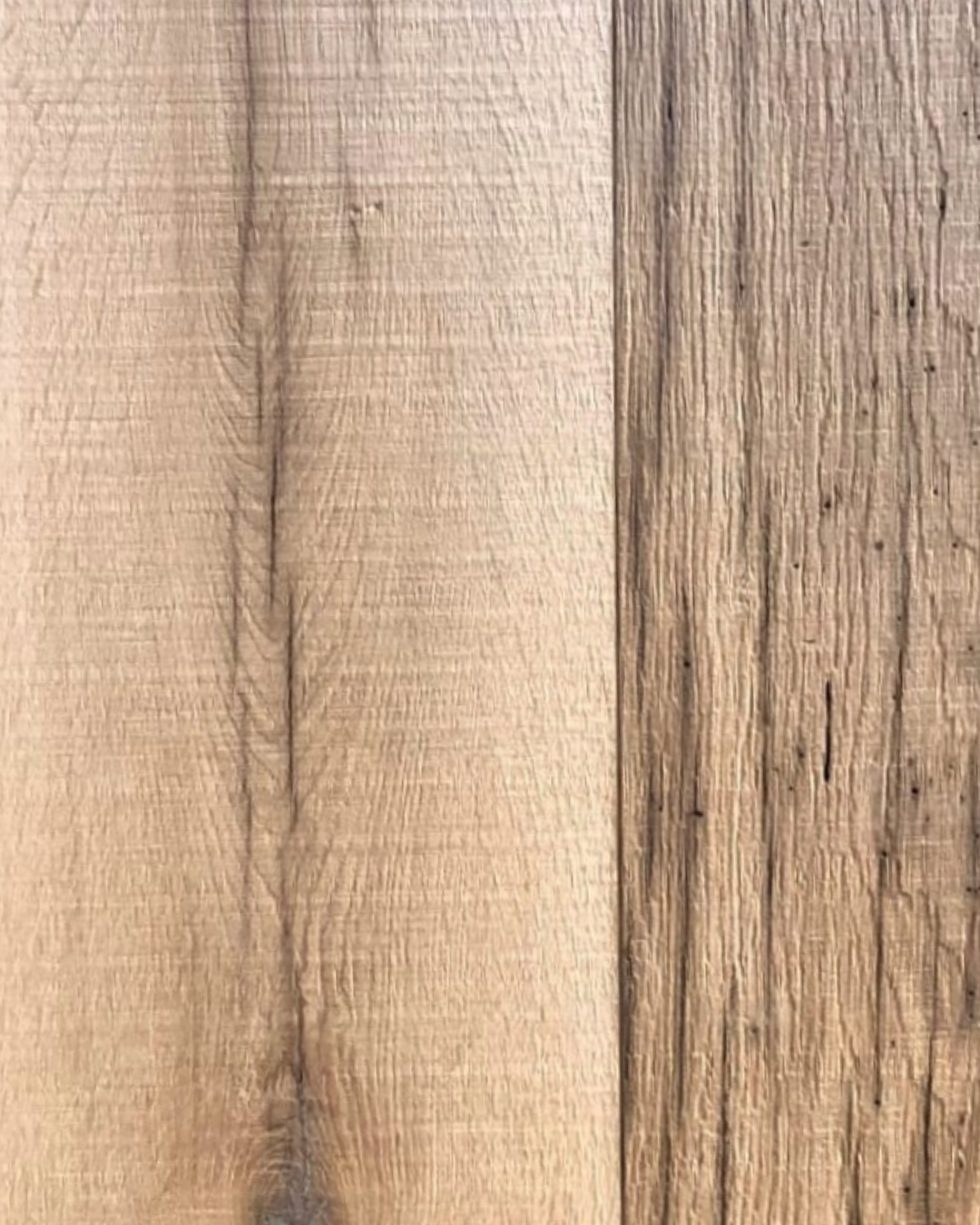 Band-sawn reclaimed oak boards showing a cleaner surface with visible saw marks and natural grain variation.