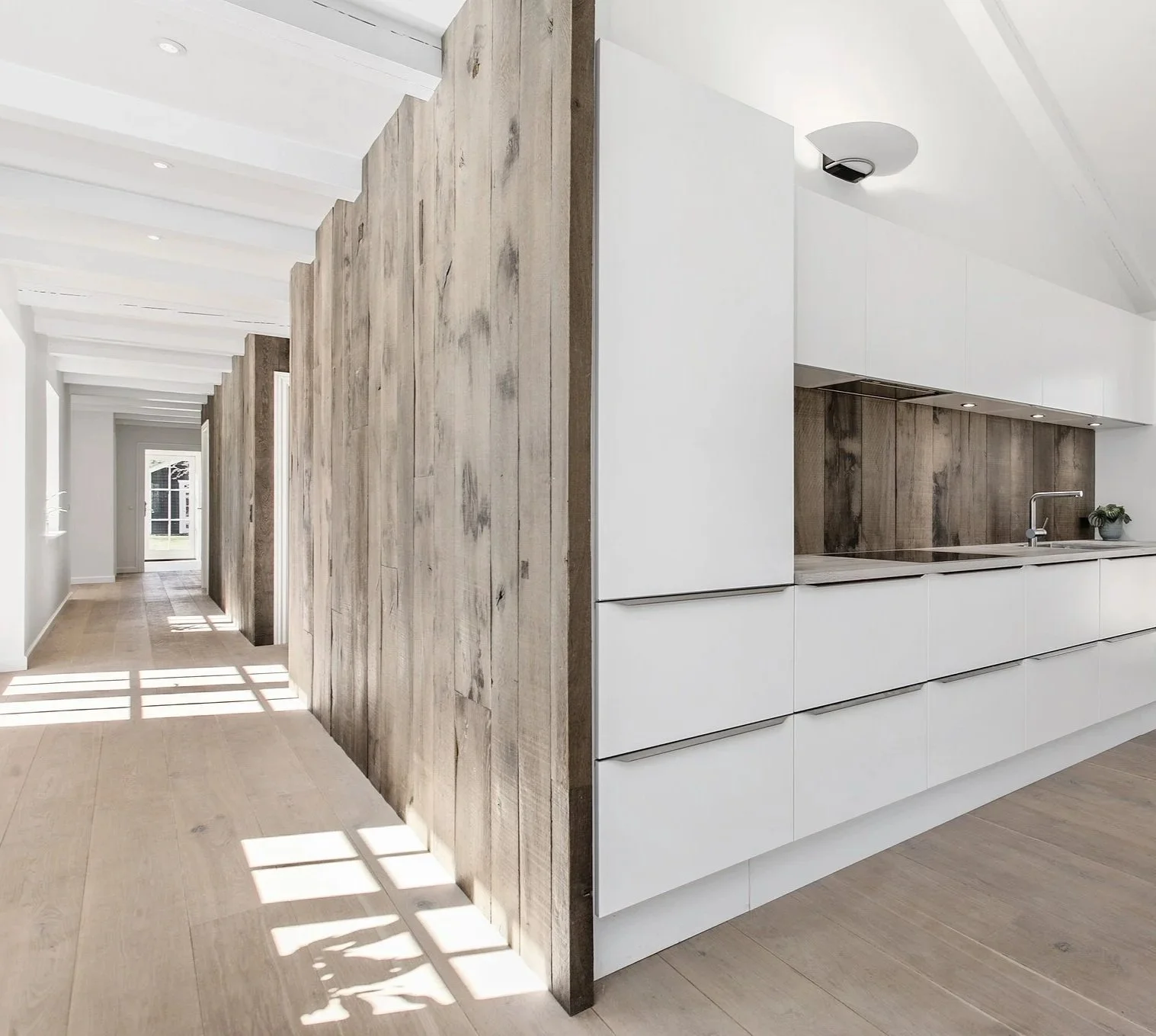 modern hallway with rustic wooden feature wall.