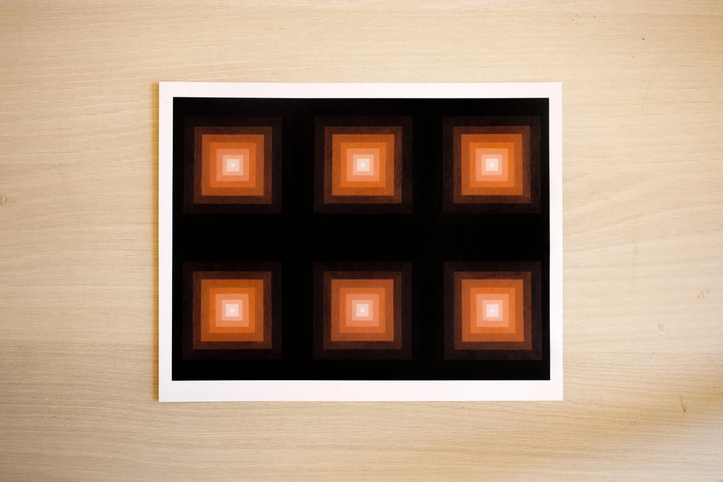 geometric art featuring a vibrant orange focal point blending into deep red-brown and black outer layers giclee fine art.jpg.jpg