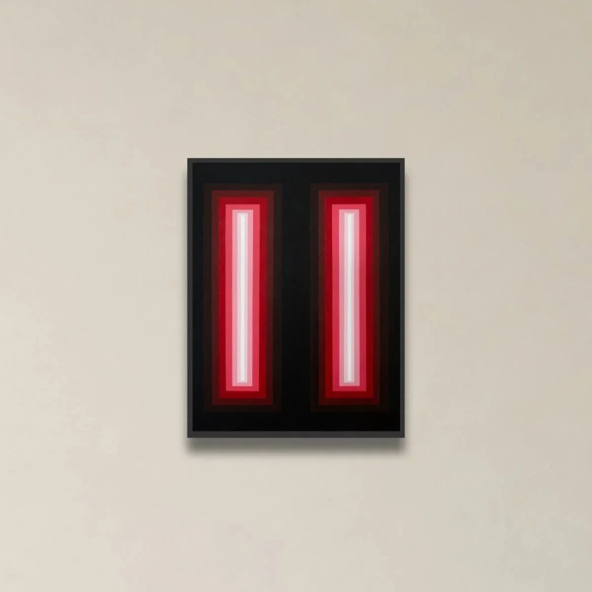 A modern framed art piece with vertical red and white stripes on a black background hanging on a beige wall.