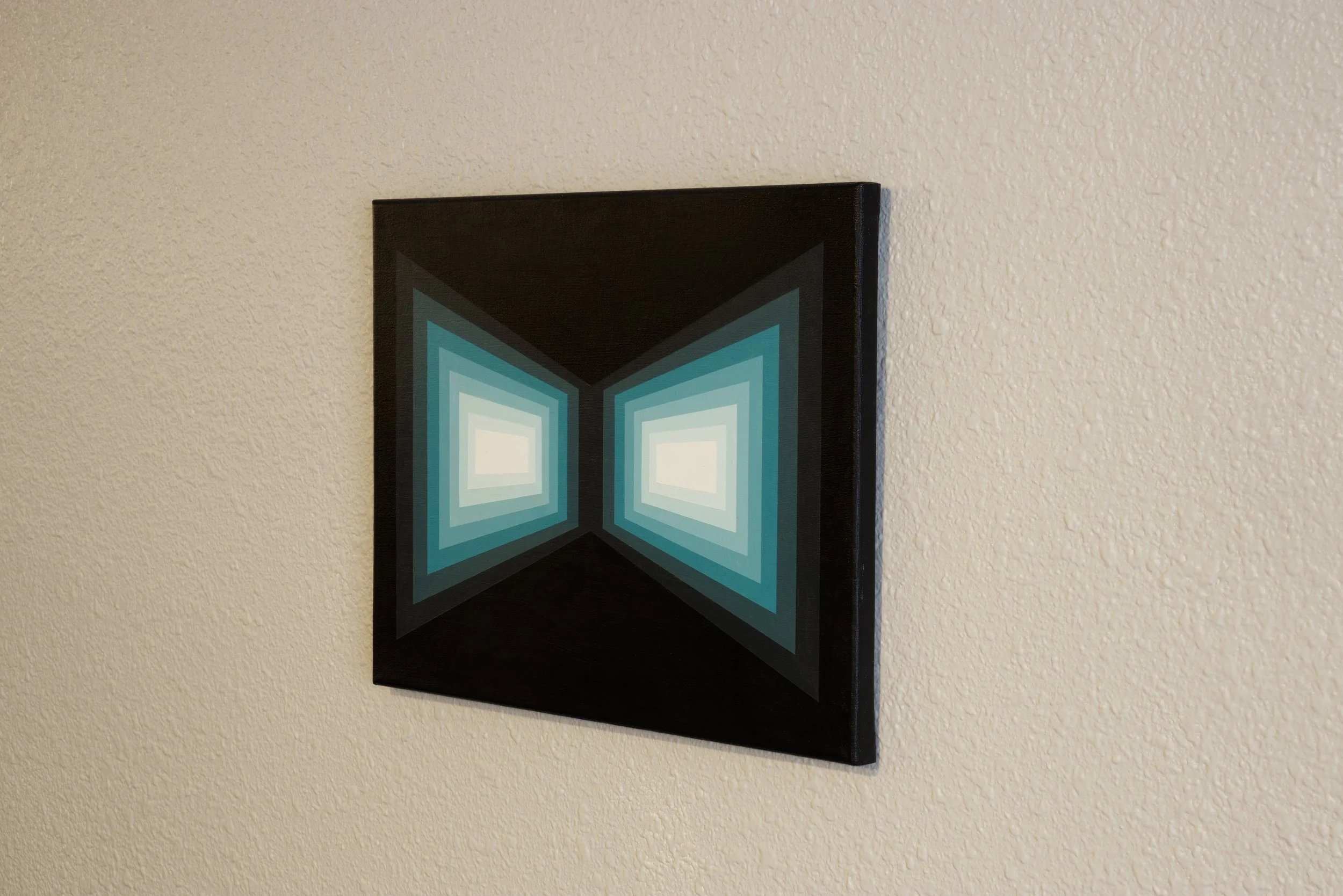 Hard-edged cyan lines and shapes receding into a dark void, transitioning from deep shadowed blue-green to bright, glowing cyan tints.jpg