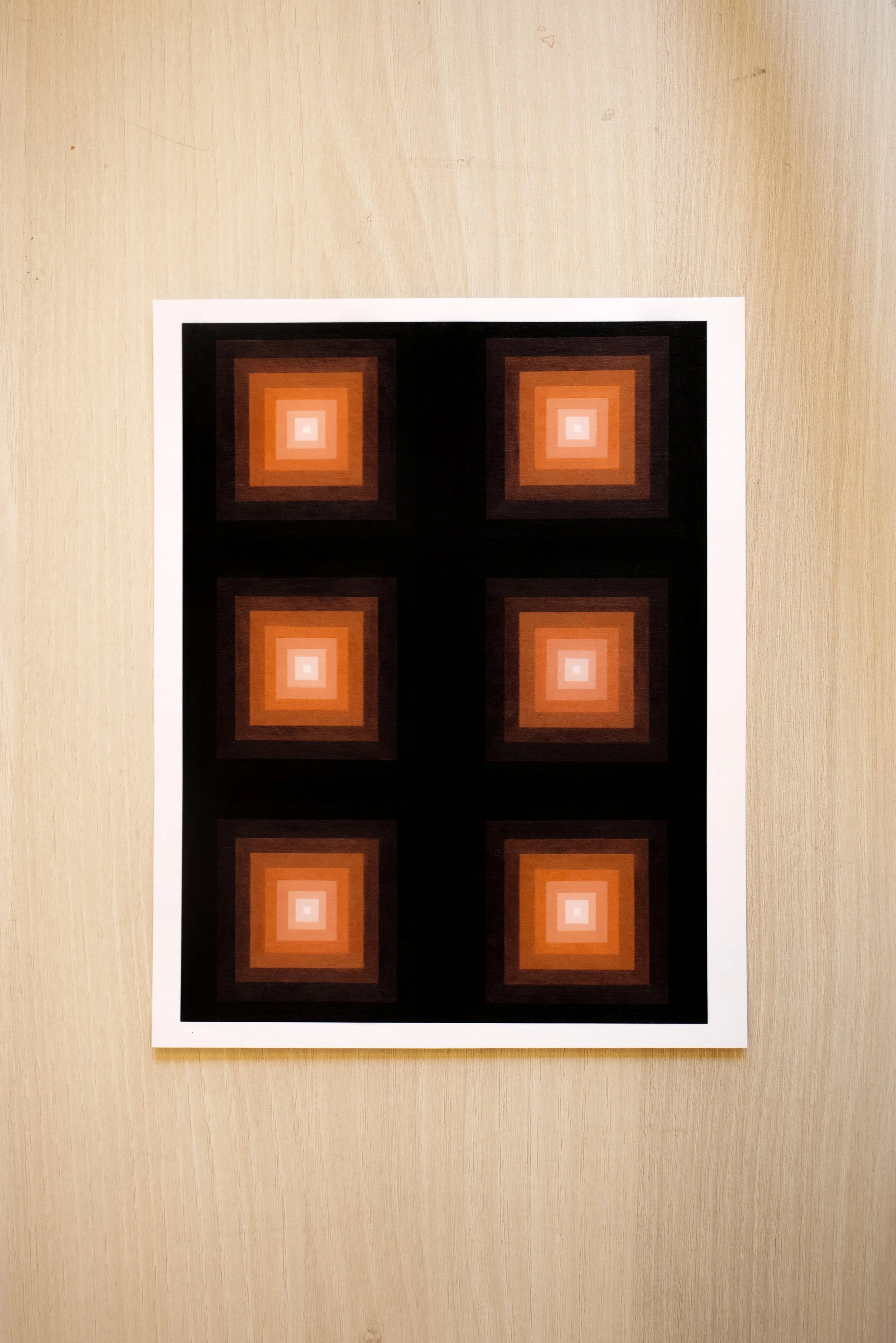 Architectural geometric art featuring a vibrant orange focal point blending into deep red-brown and black outer layers vertical.jpg