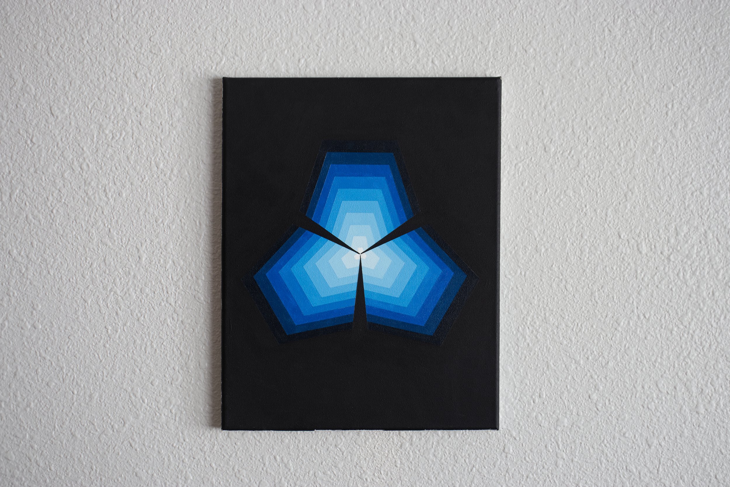 Monochromatic azure blue abstract painting featuring a structured background of interlocking and layered geometric pentagons.jpg