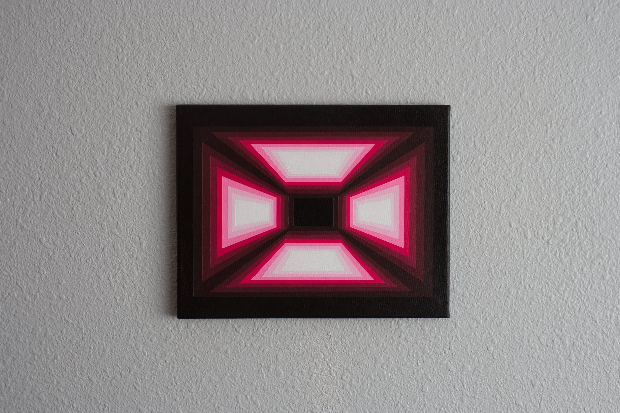 Three-dimensional neon pink abstract canvas utilizing sharp value shifts to make geometric forms pop and recede simultaneously.JPG