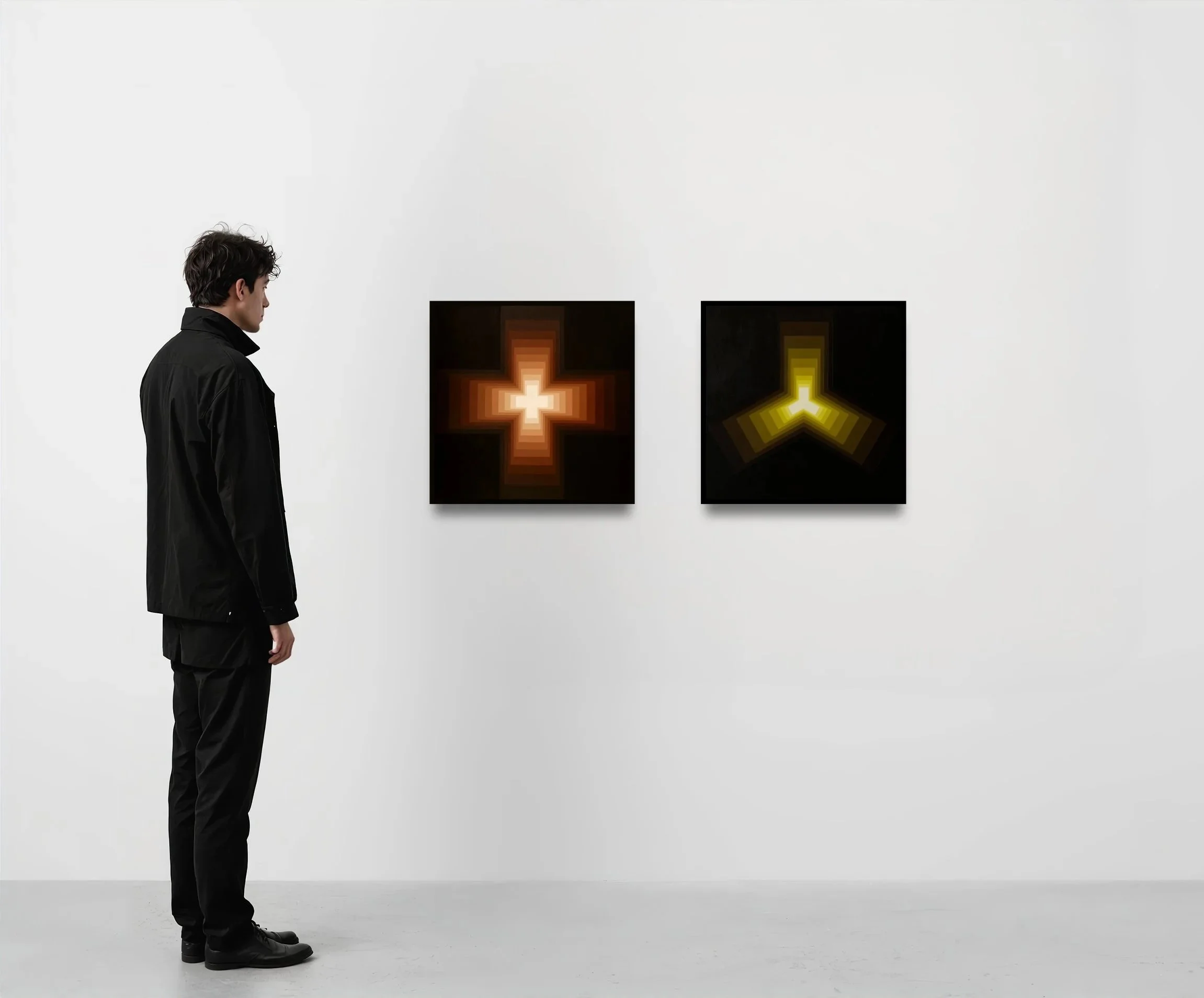 A man with dark, wavy hair stands in profile, wearing a black jacket and pants, in an art gallery, looking at two abstract pixelated artwork pieces with geometric shapes, one with a cross-like pattern and the other with an arrow-like pattern, both illuminated in warm tones against a white wall.