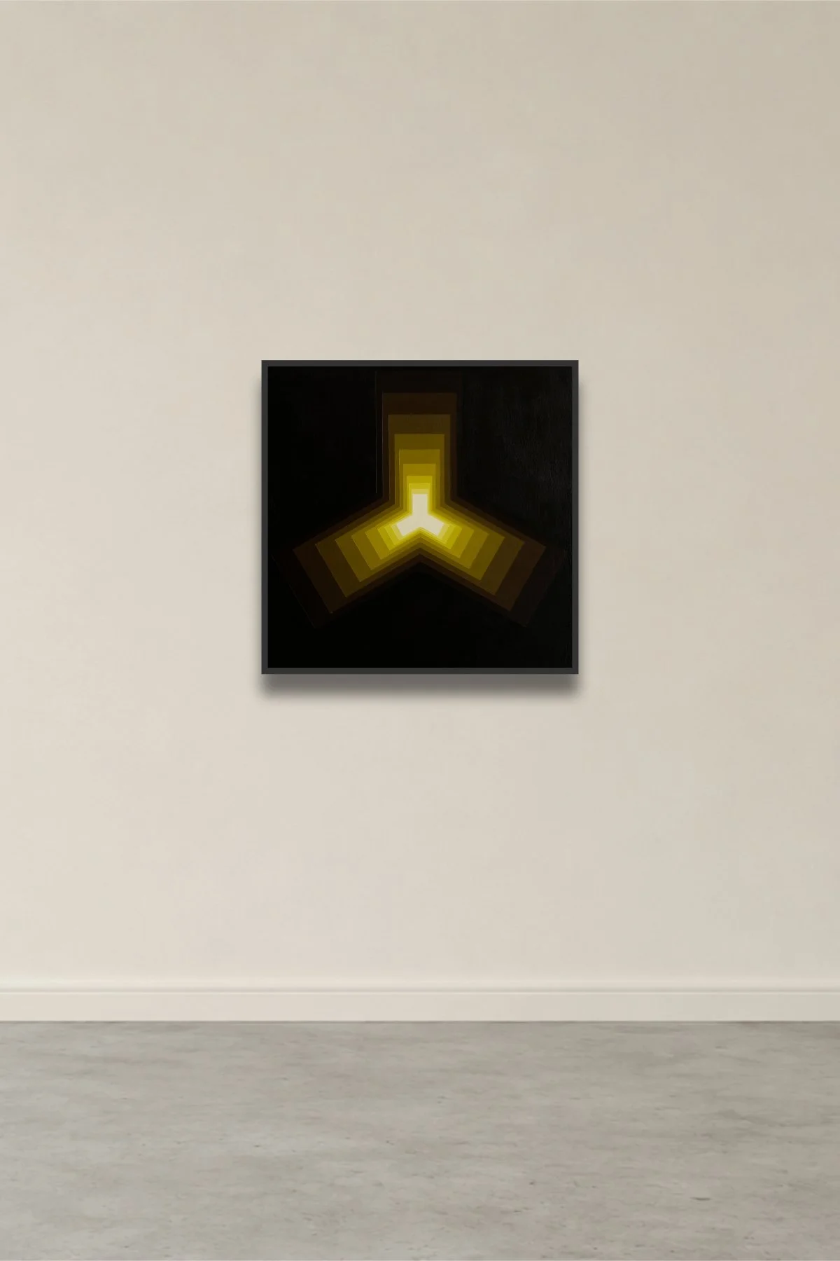 Abstract artwork with a black background and a central Y-shaped yellow pattern, displayed on a gallery wall.