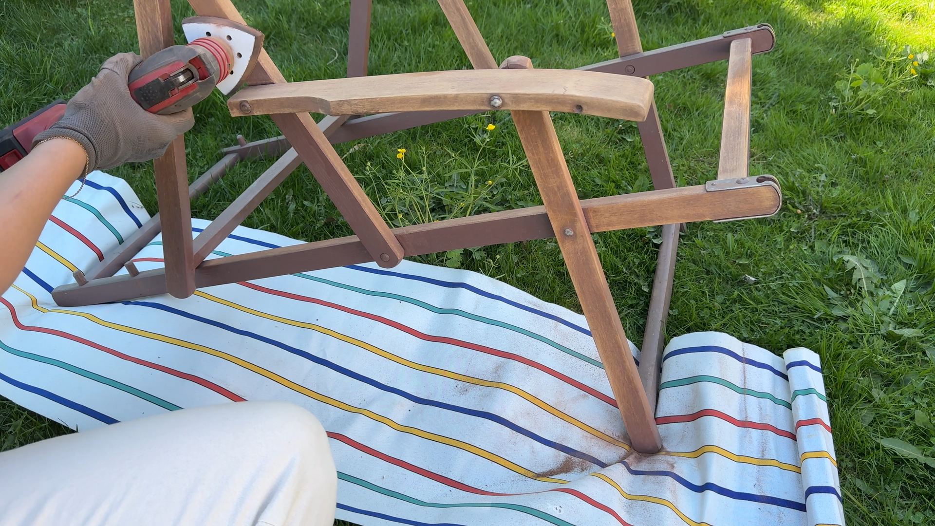 Sanding the old covers from the deckchairs