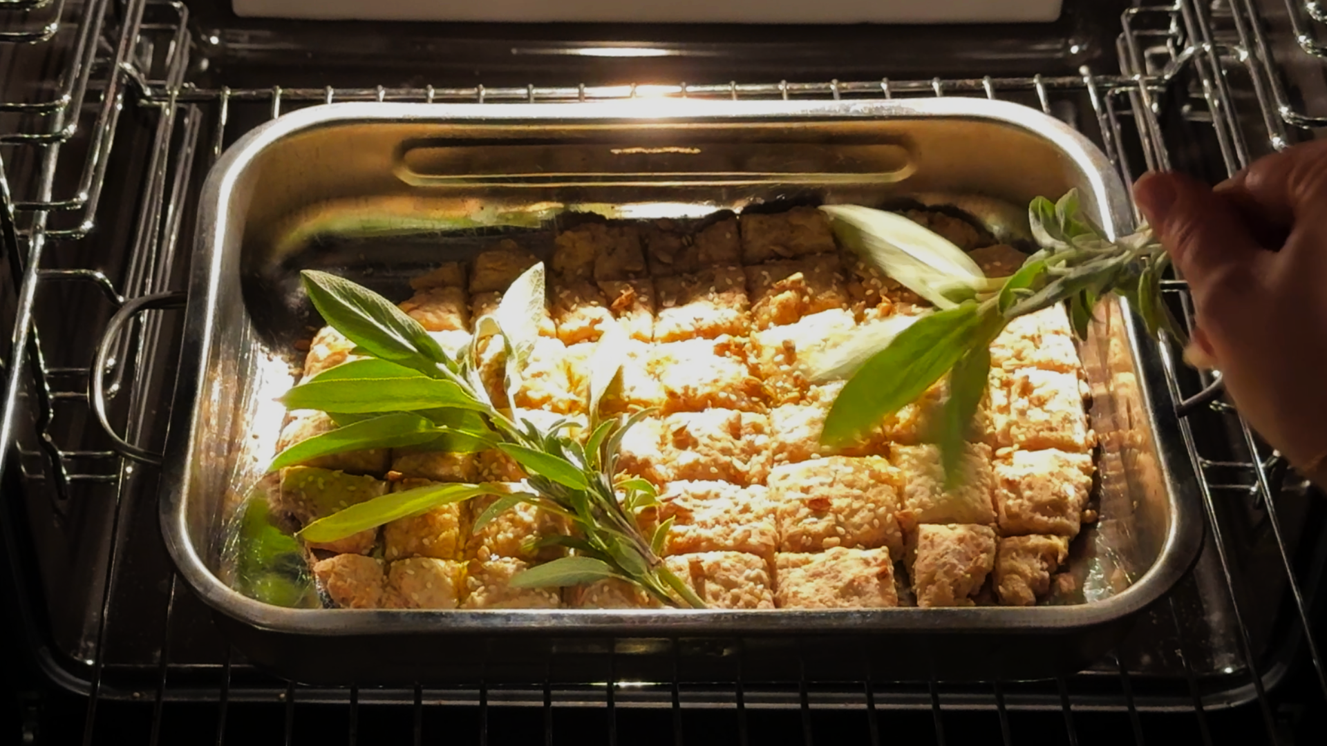 Garnishing fondue bread with sage