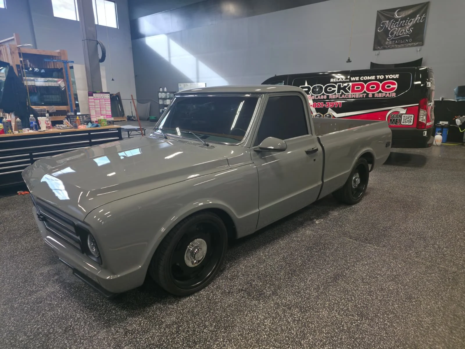 Classic silver pickup truck inside the RockDoc Auto Glass workshop.jpg