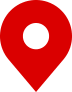 Map pin icon in red with white circle in the center