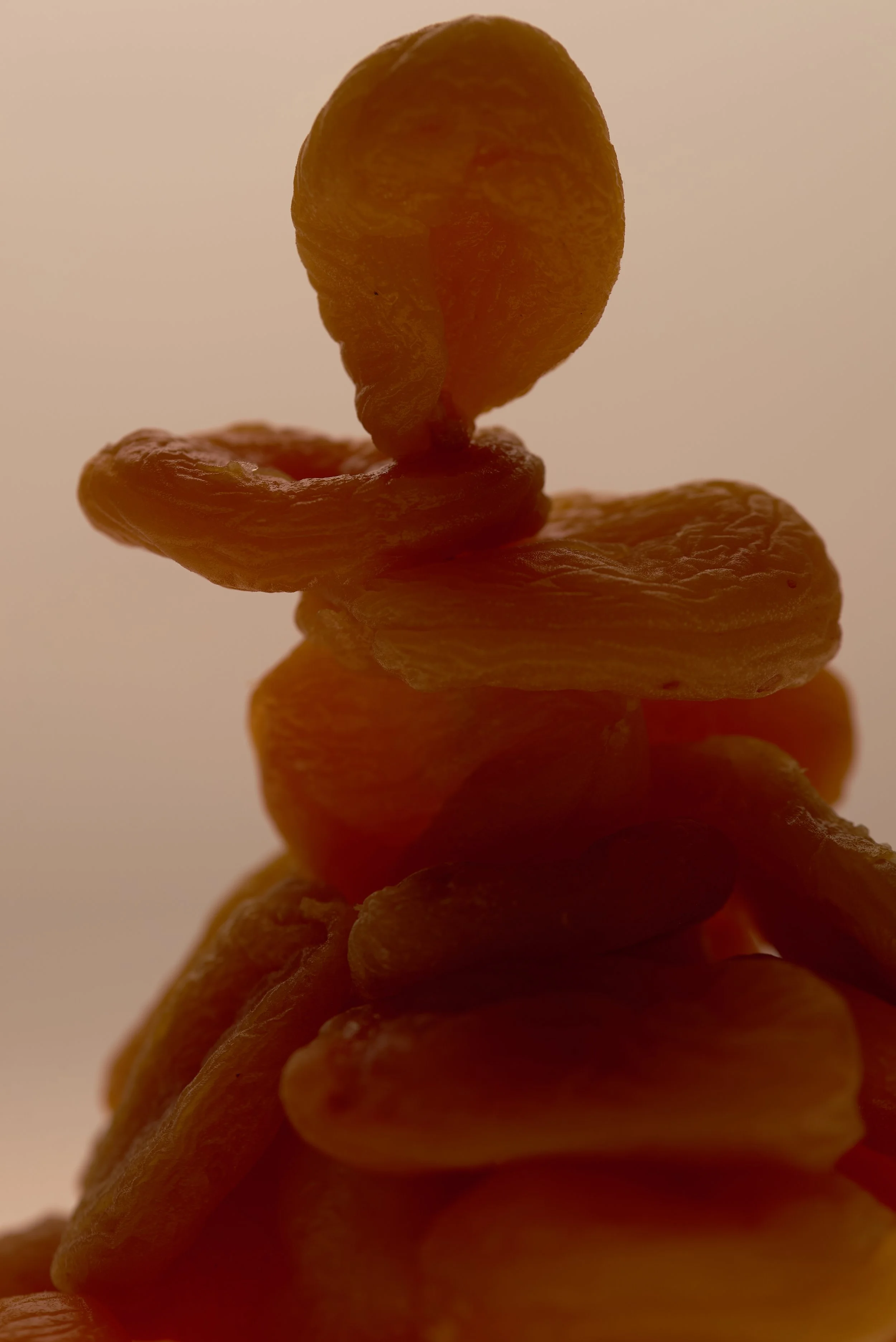 Close-up of a pineapple slice stacked on top of other slices, highlighting the texture and color.
