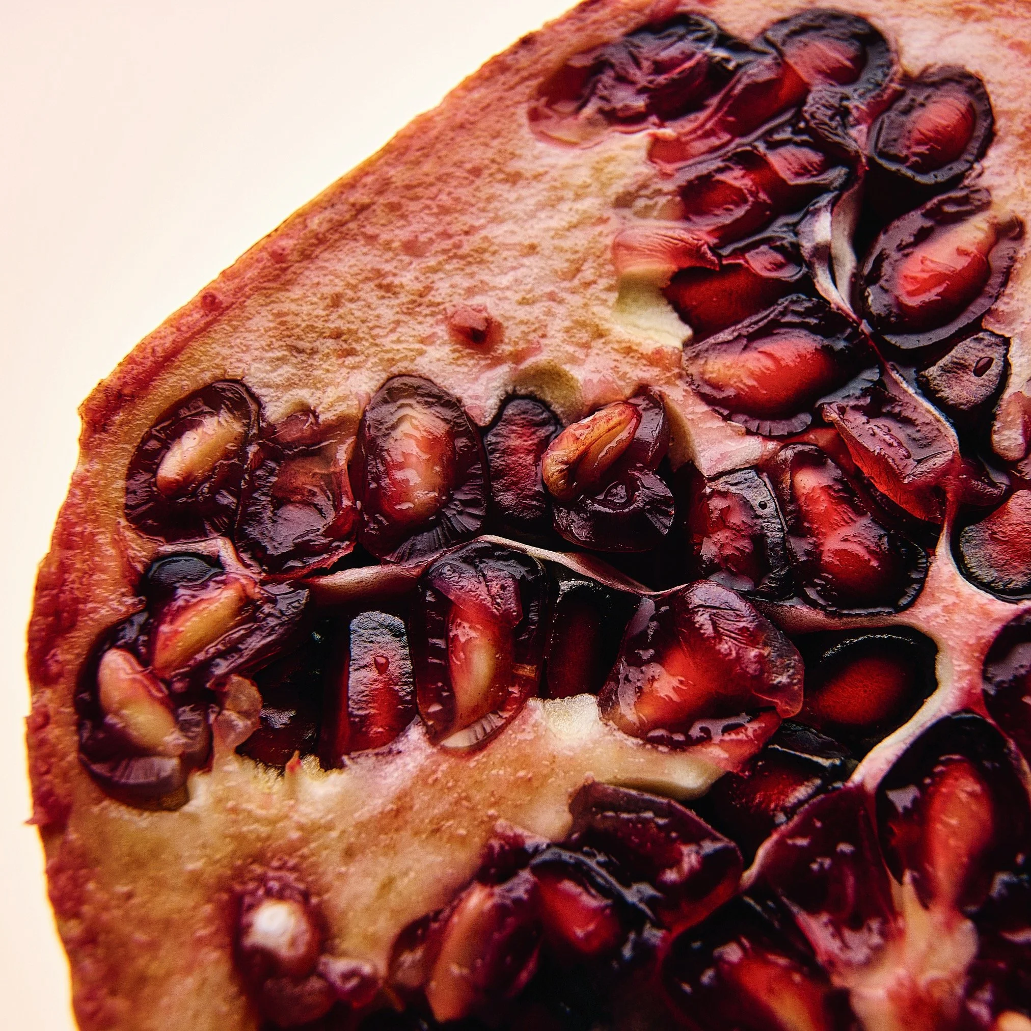Close-up of a slice of cherry pie showing dark cherries and a golden crust.