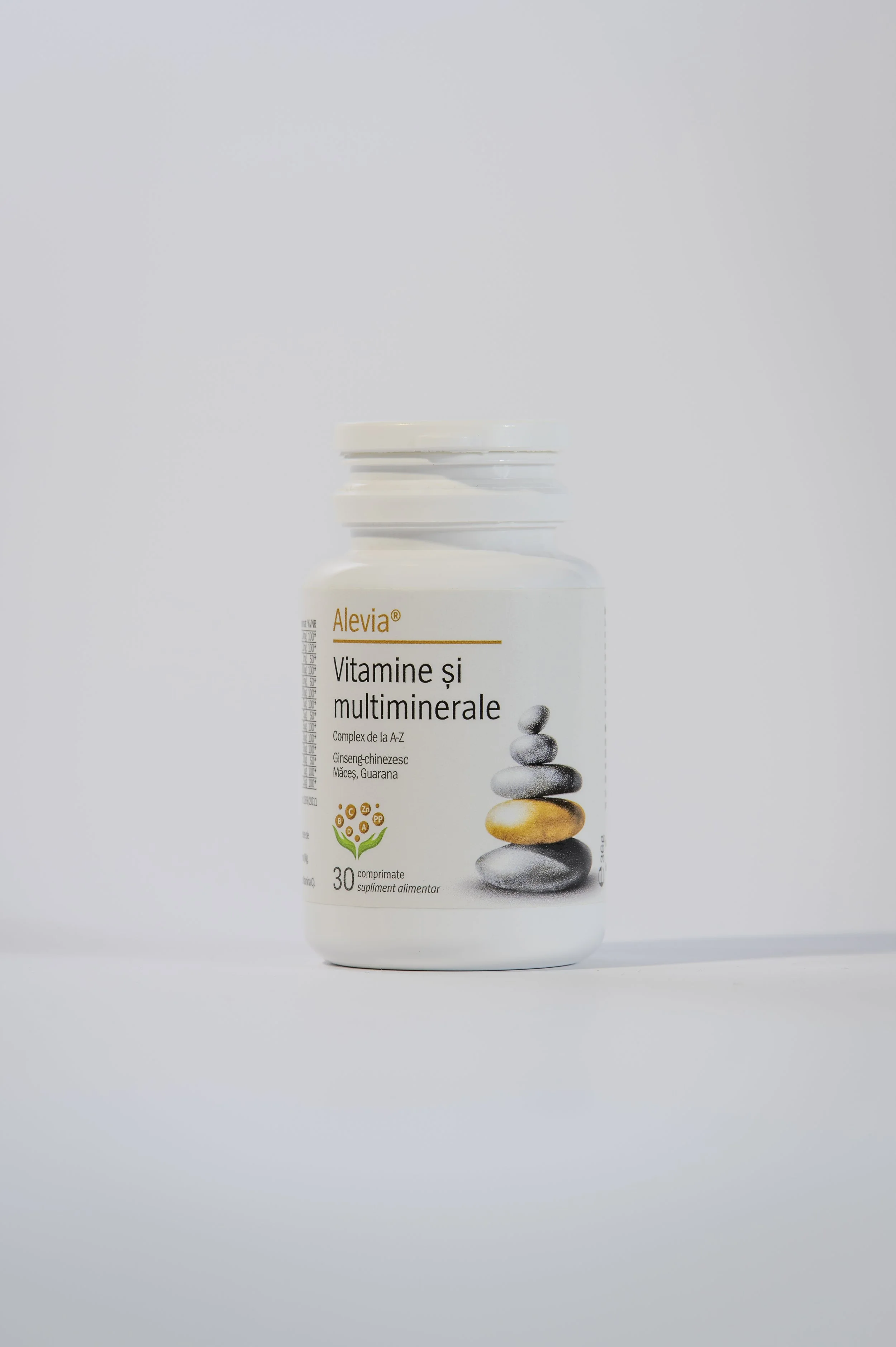 A white bottle labeled 'Alevia Vitamin and Multimineral Supplement' with a stack of stones graphic, set against a plain white background.