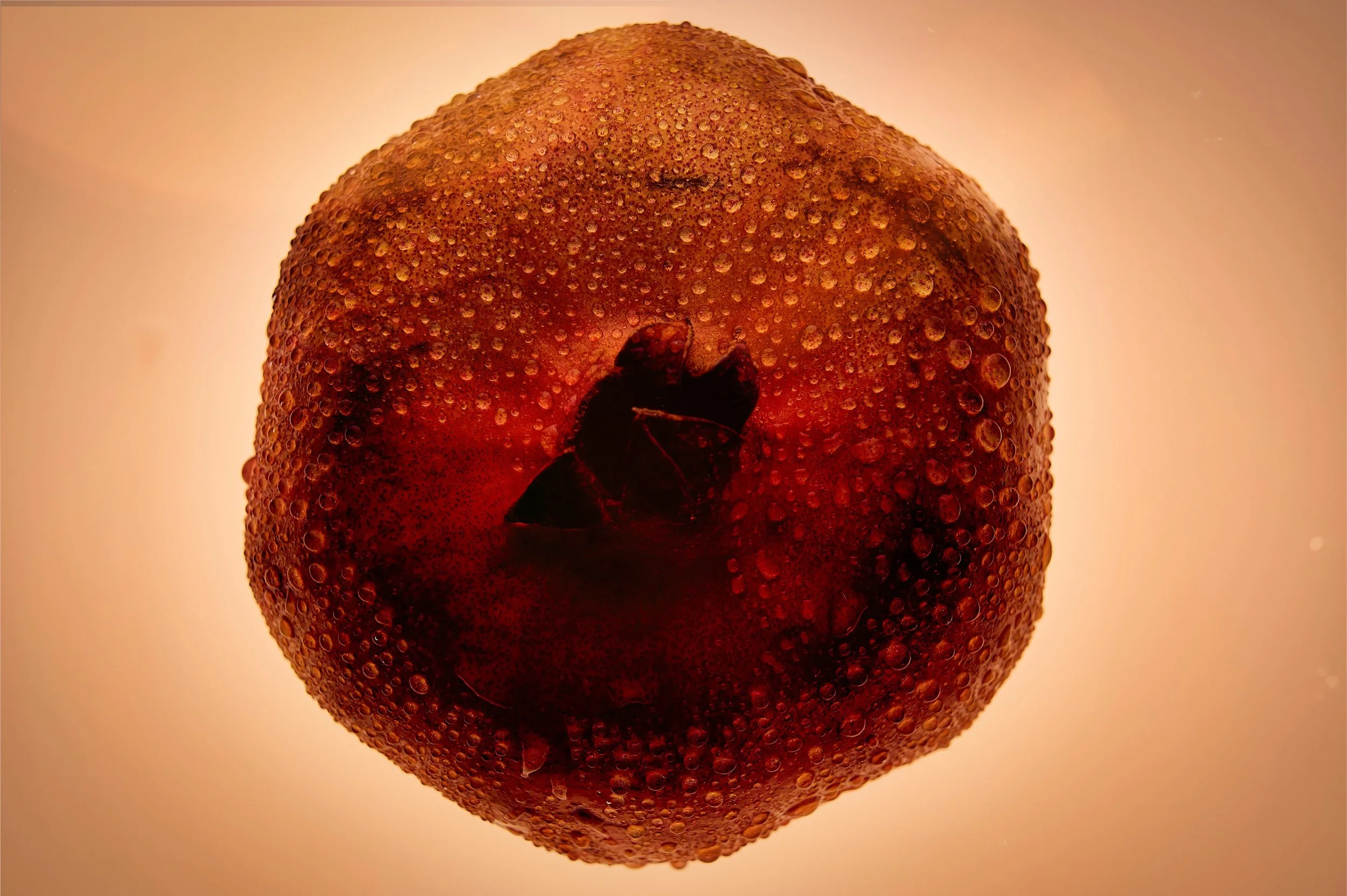 Close-up of a ripe red strawberry with water droplets on its surface