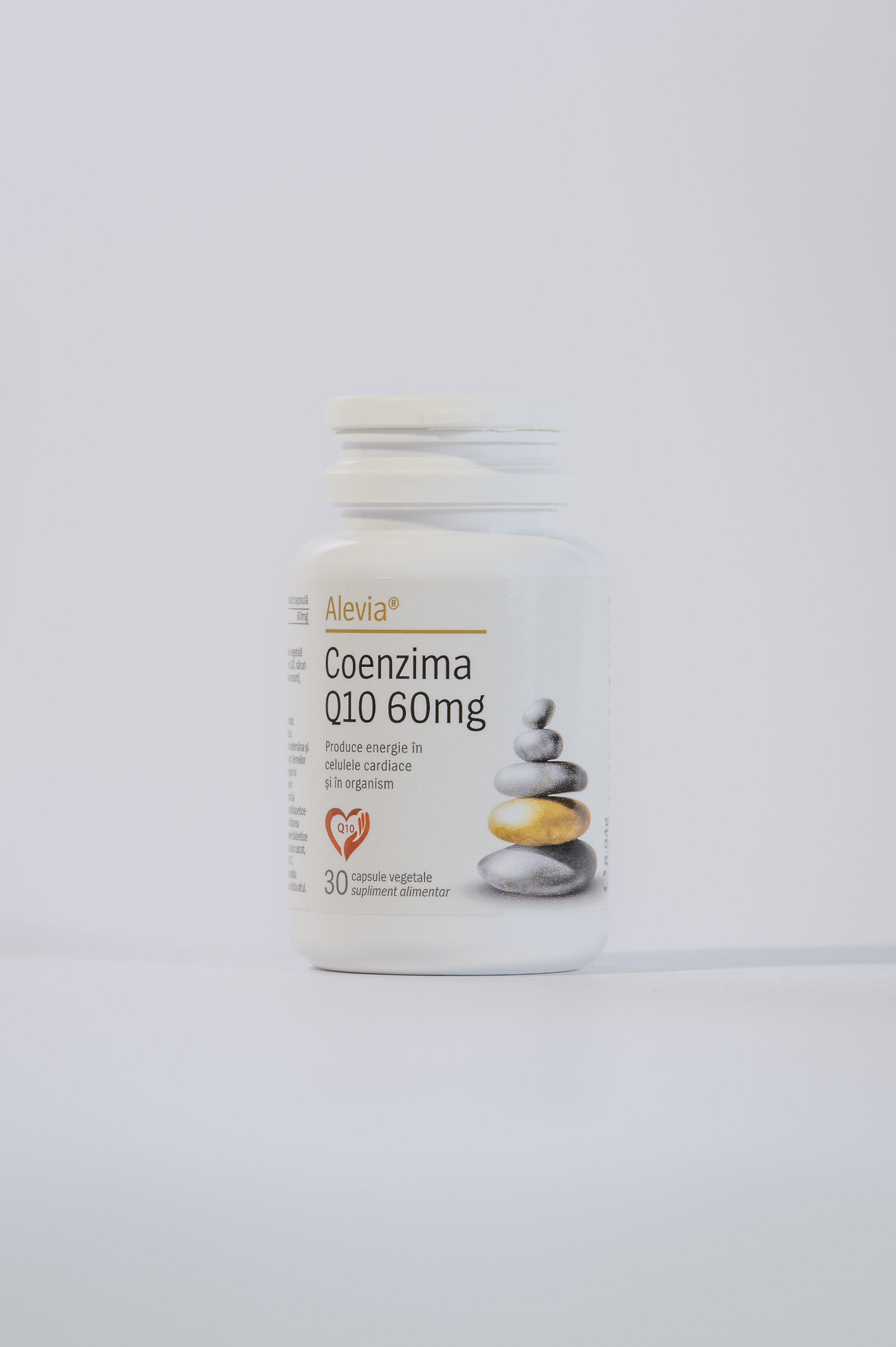 A white bottle of Alevia Coenzima Q10 60mg dietary supplement with an image of stacked stones and a heart symbol on the label.