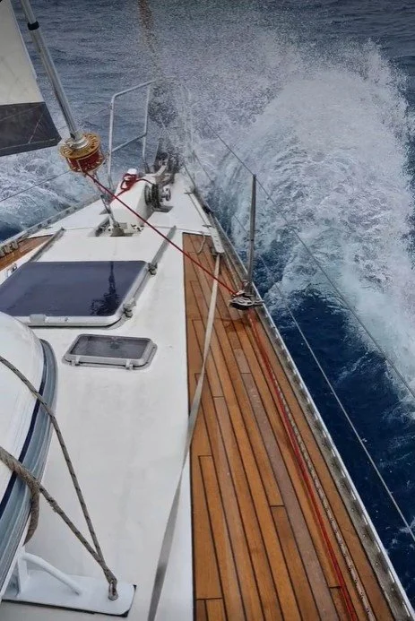 Cruising yacht sailing in offshore conditions, highlighting the importance of matching a furling system to boat size, rigging, and intended use.