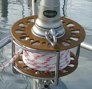 Close-up of a Reefit headsail furler showing the furling drum and line assembly.