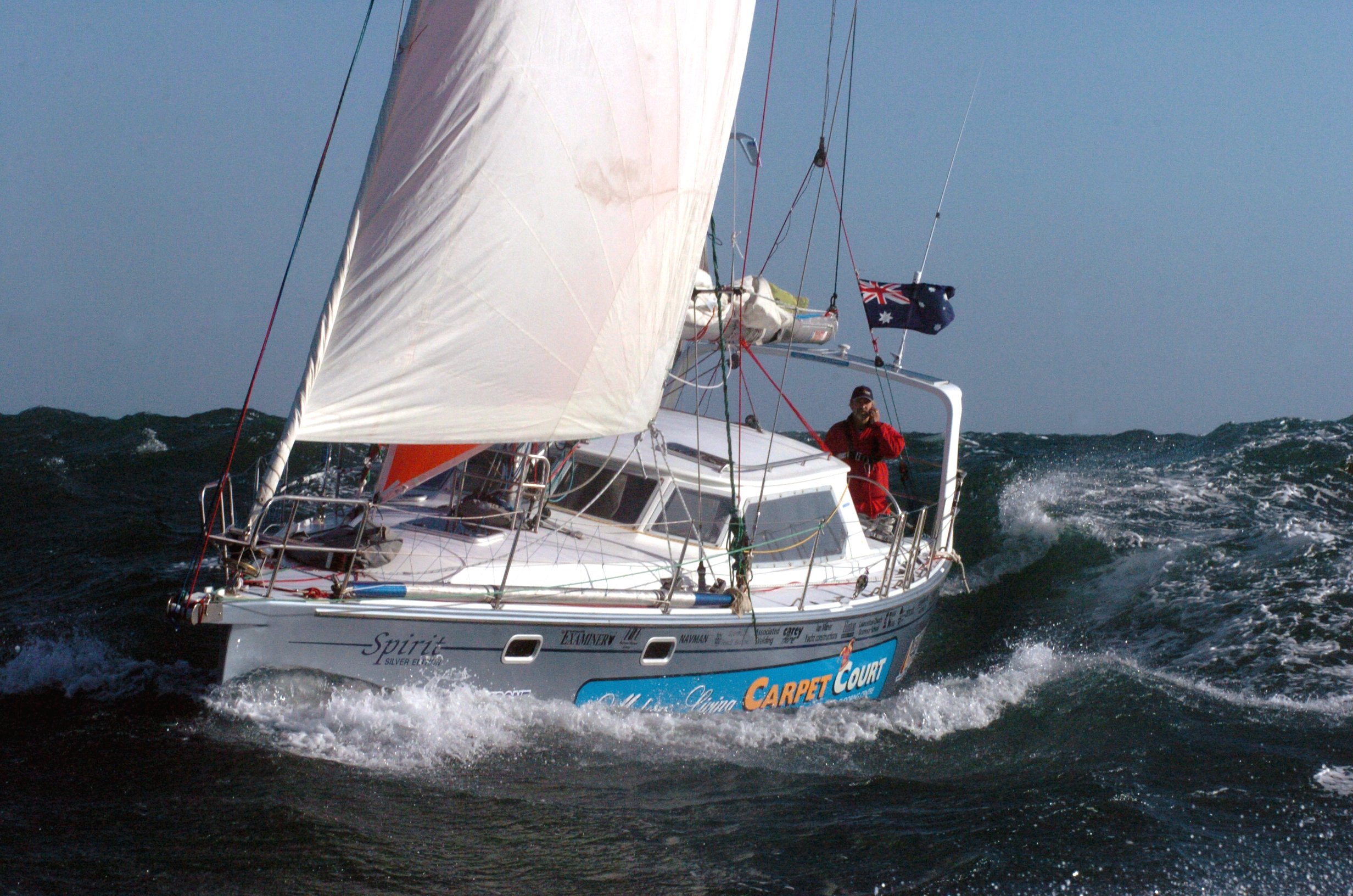 Offshore sailing yacht in rough sea conditions during a world record circumnavigation using a Reefit headsail furling system.
