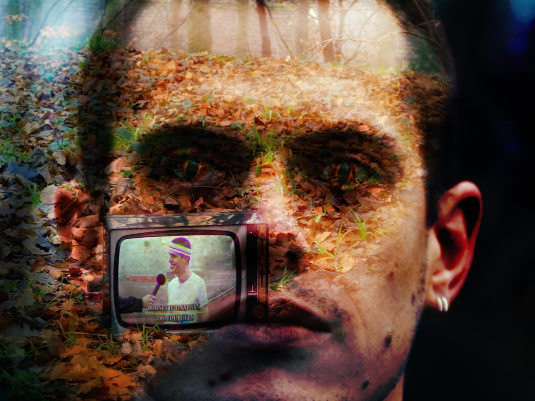A double exposure image from a music video, combining a face with a scene of a forest floor covered with fallen leaves and a television set showing an athlete giving an interview.