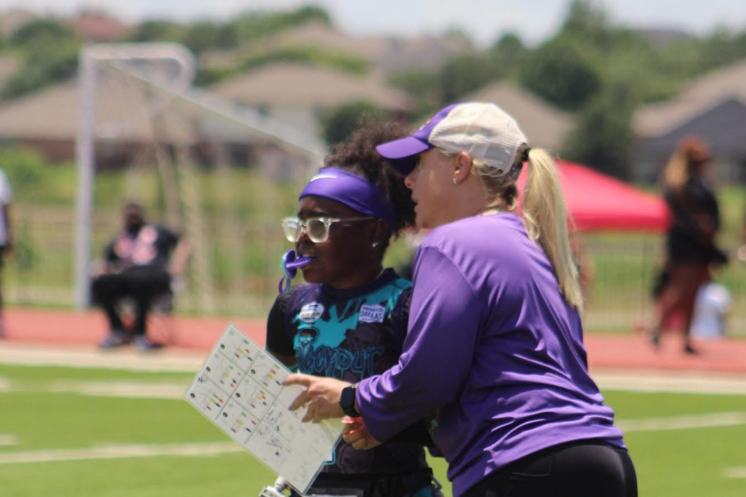 Girls’ flag football coach Shannon Landry coaching player