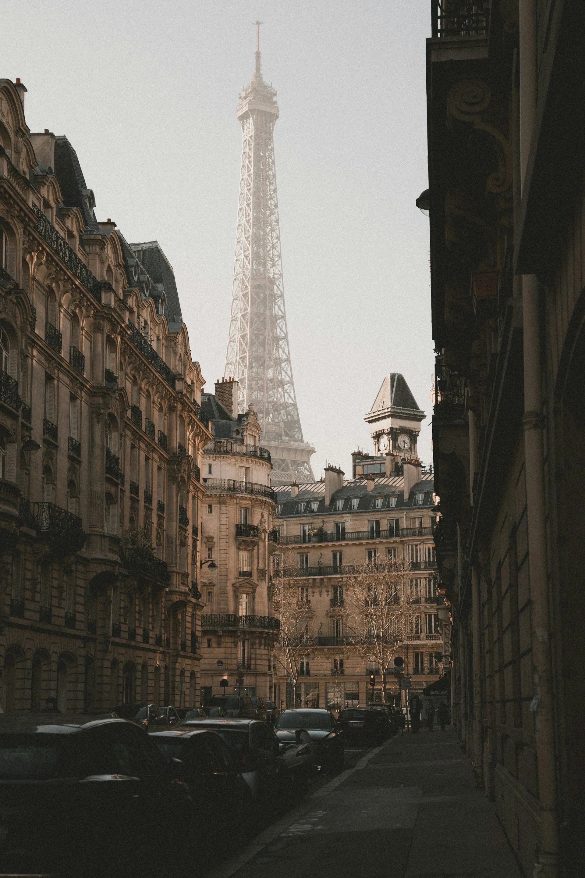 Wedding Website Design, Digital Wedding Stationery, Web Design and Branding for Wedding Professionals | Avelã White. Street view with the Eiffel Tower and classic Parisian buildings.