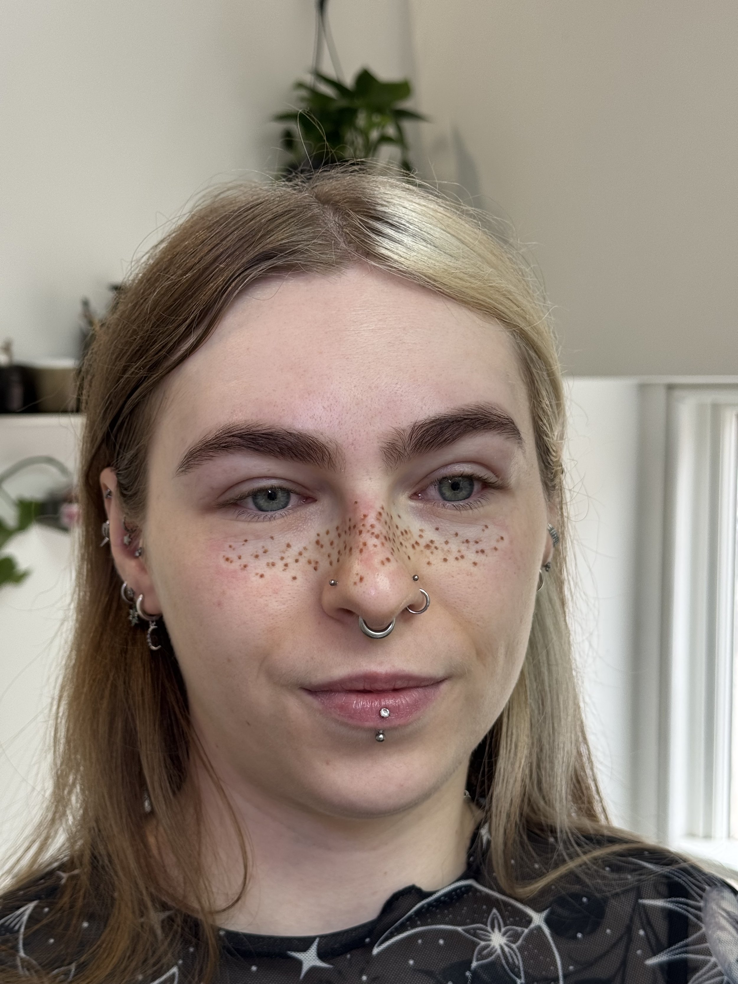 Light coverage faux freckle tattoos