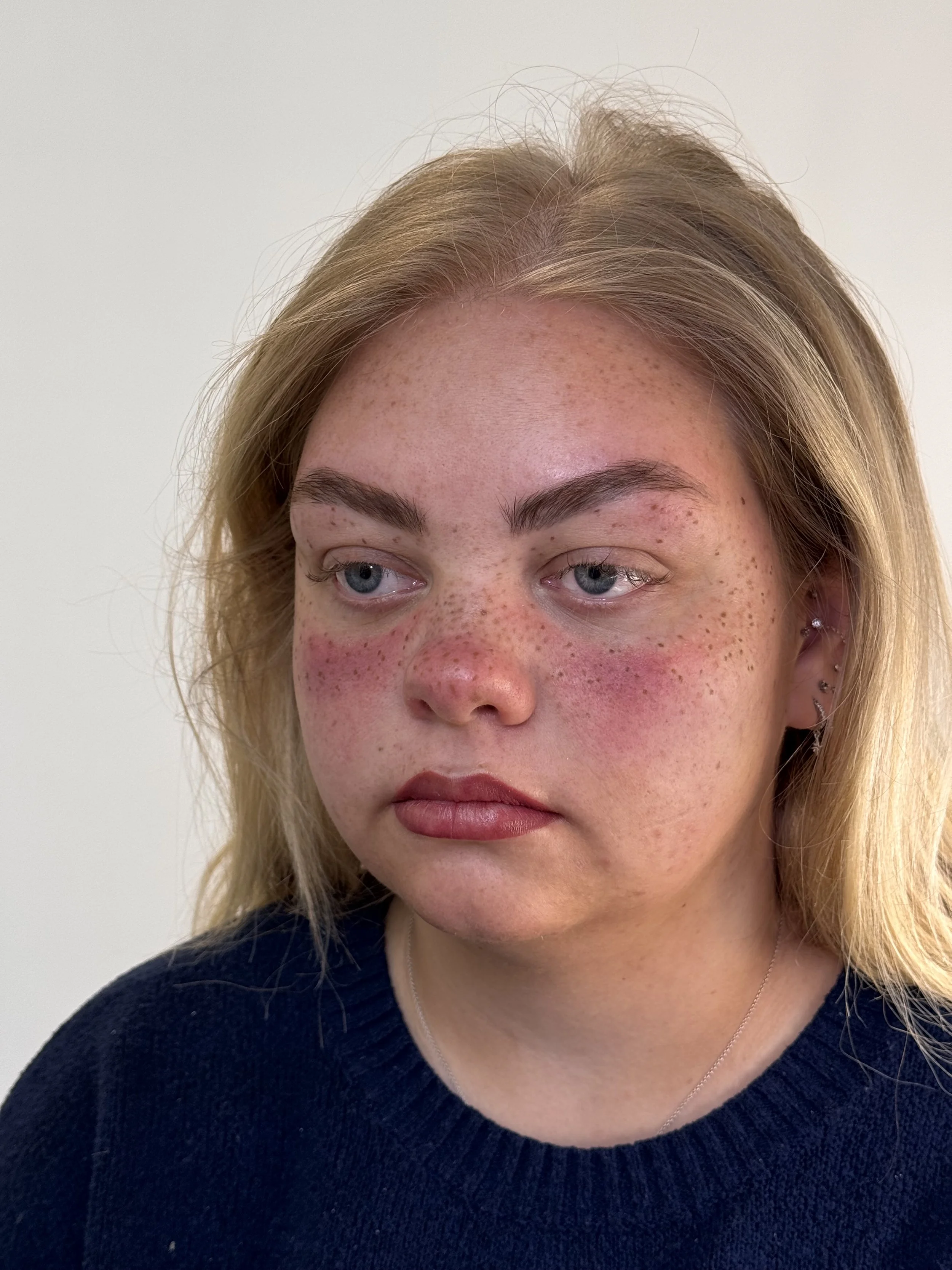 Heavy coverage faux freckle tattoos