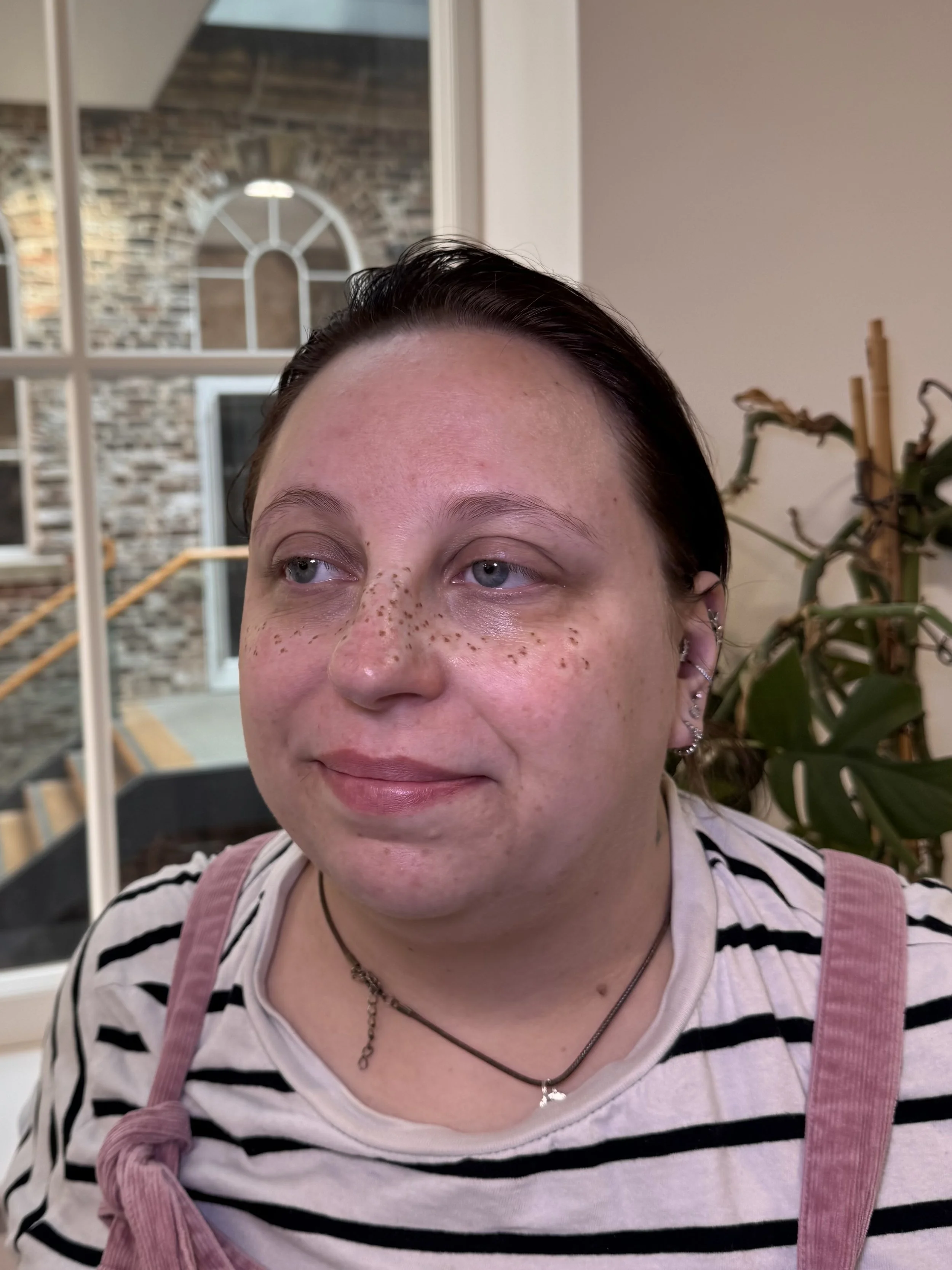 Light coverage faux freckle tattoos