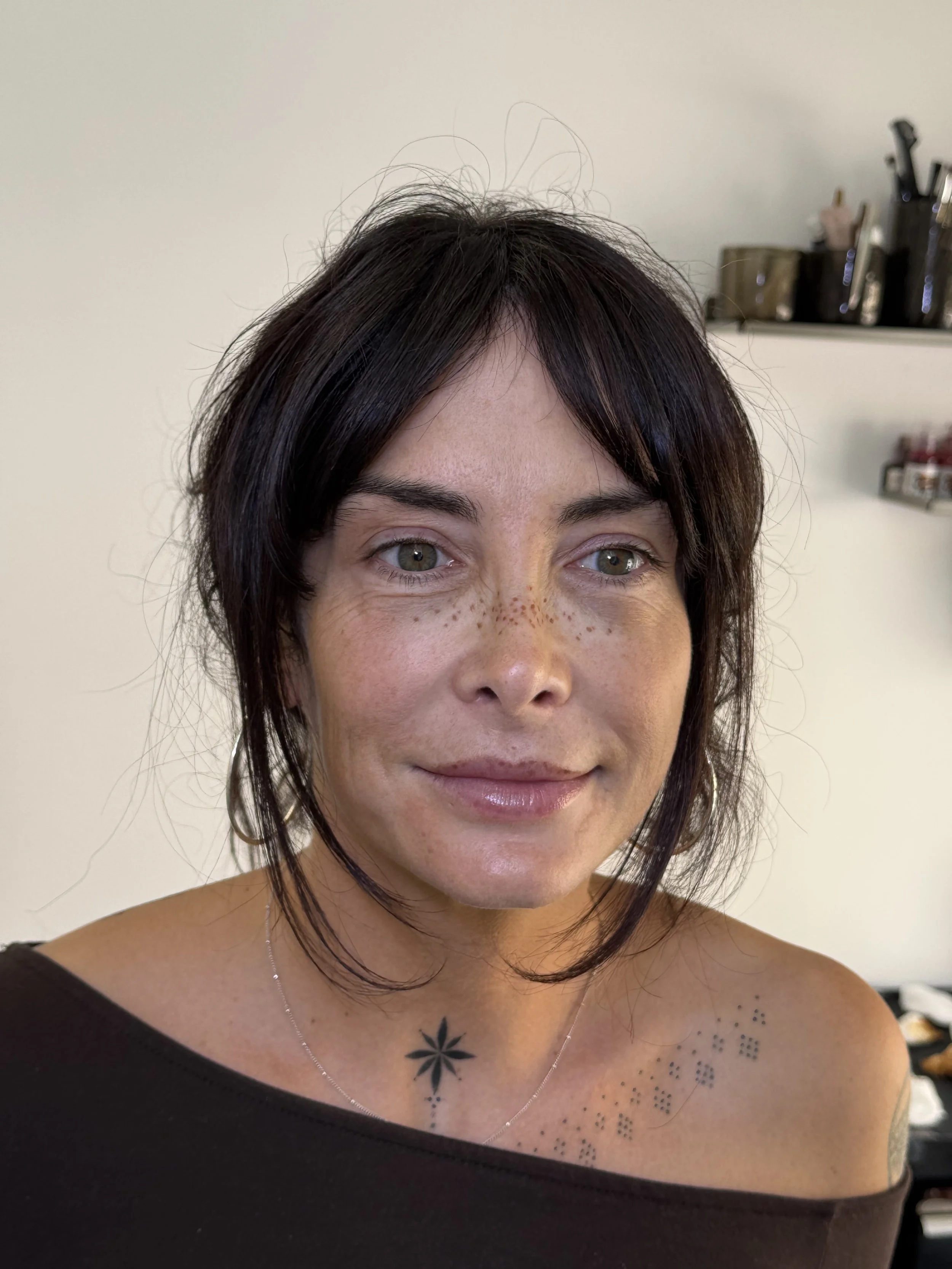 Light coverage faux freckle tattoos