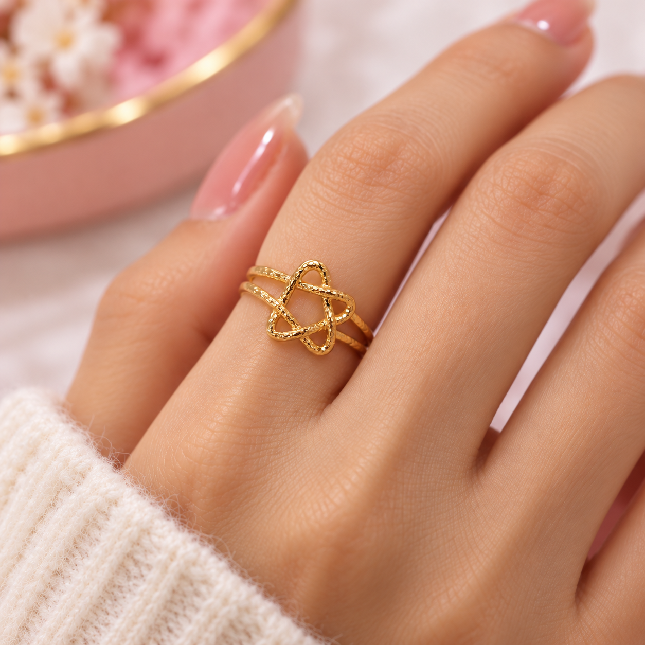 Delicate Gold Knot Ring Close-Up.png