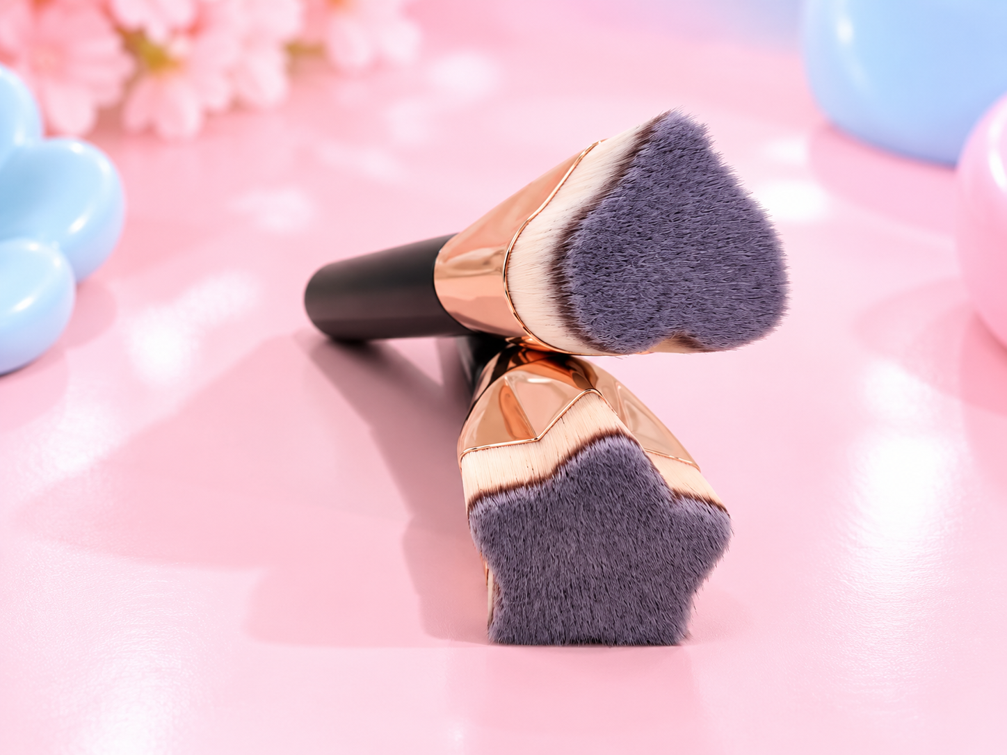 Heart-Shaped Makeup Brushes on Pink.png