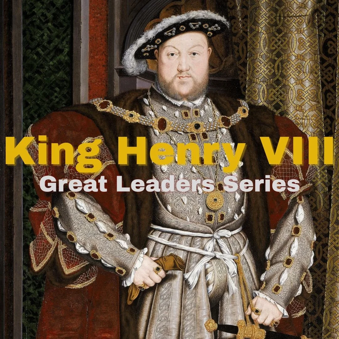 Painting of King Henry VIII dressed in ornate royal attire with jewelry and a fur-trimmed gown, standing with hands on his waist.