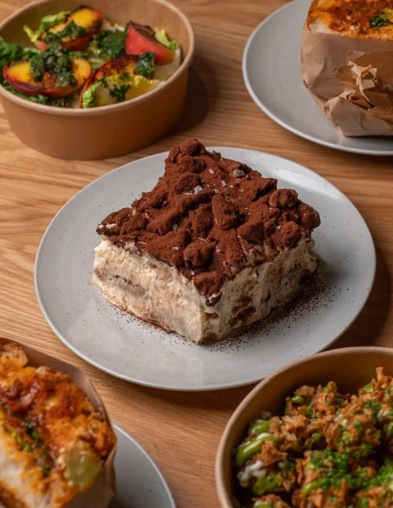 Italian comfort food from Alla Mano with focaccia sandwiches, crispy loaded patatine, fresh stracciatella peach salad and Ovomaltine tiramisu in Zurich