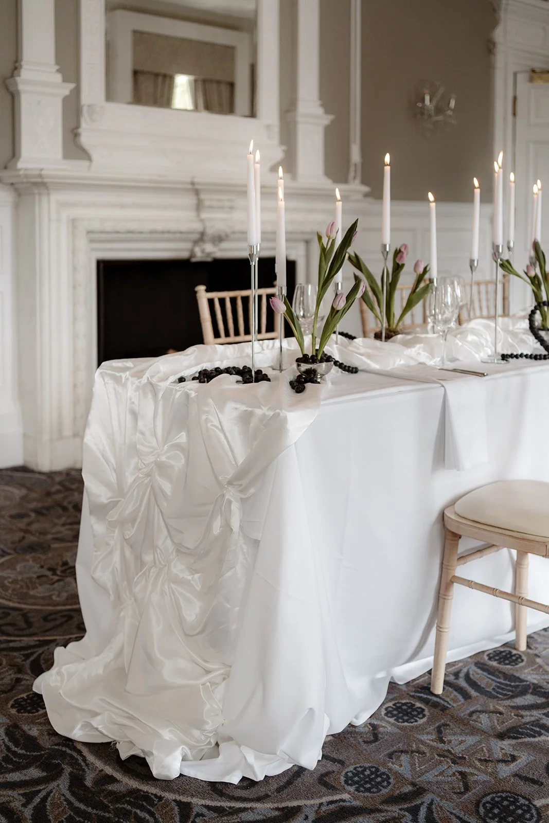 Silk draping, seasonal tulips and sculptural blueberries.

The stationery remained the focal point, framed by soft fabric, clean glassware and tonal fruit styling. Using in-season tulips kept the florals feeling architectural and a bit different!

Mo