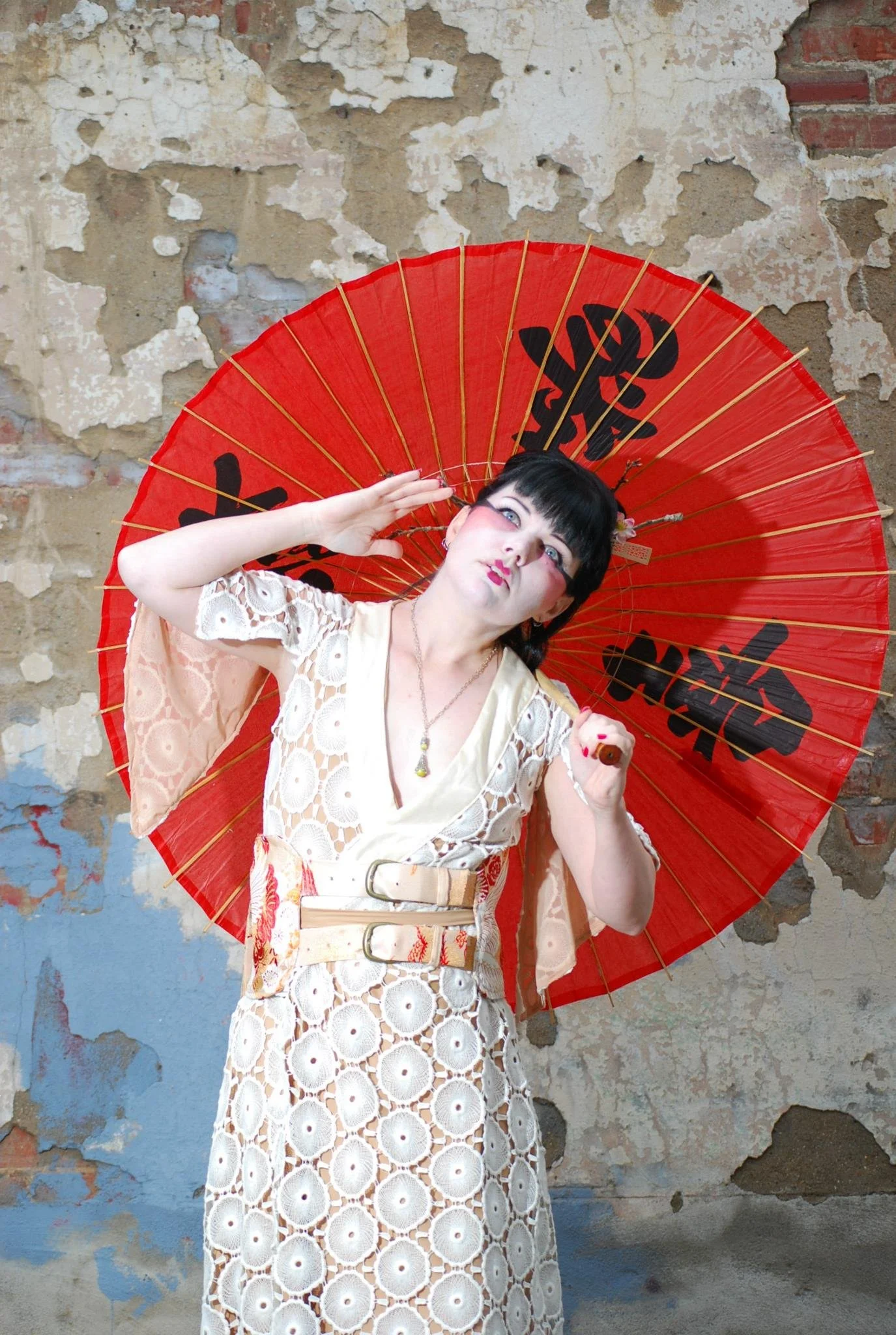 Frint view of wrap dress and belt. the V-neck has solid kimono silk detail
