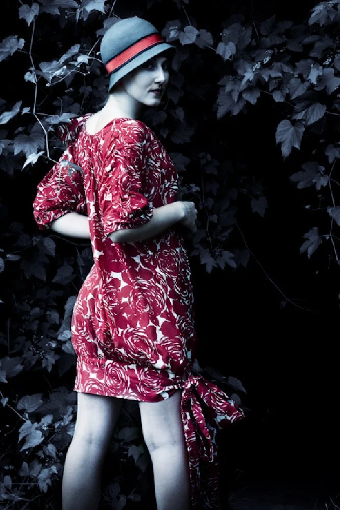 Red cotton voile dress with shoulder bow and hem bow details-back view