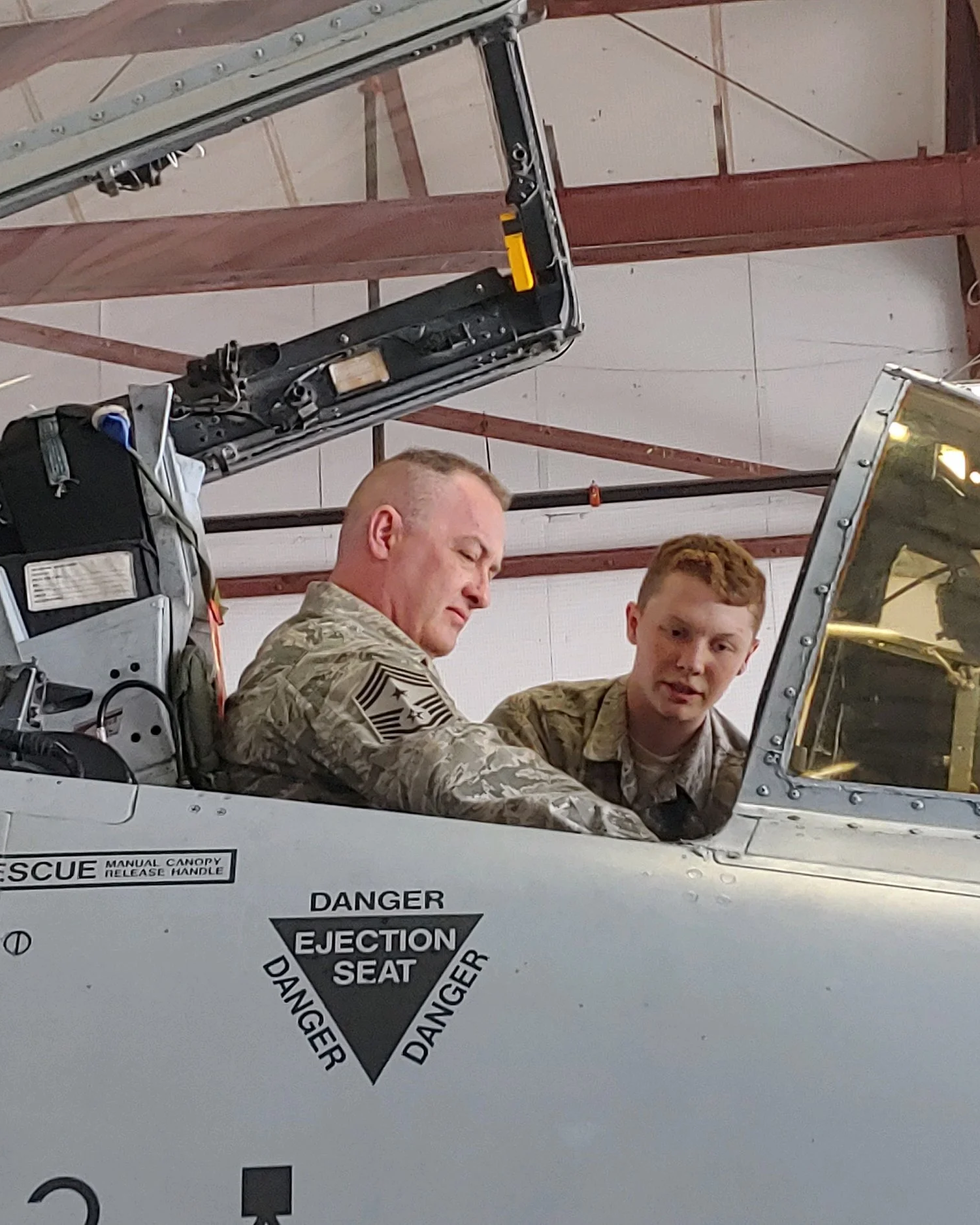 Michael May coaching his son, a junior airman, reflecting the leadership foundation of his men’s coaching in Nashville.