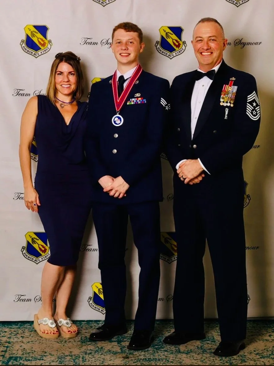 Michael May, founder of Strategic Life Coaching for Men, with his family at Patrick May’s Airman Leadership School graduation, reflecting military leadership, mentorship, and a family legacy of leadership development.