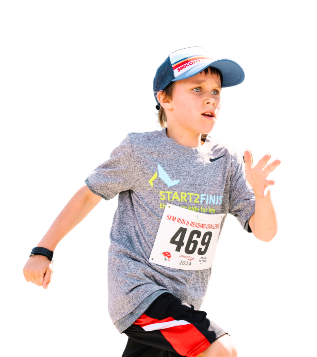 A young boy running in a race wearing a gray T-shirt, black and red shorts, a blue cap, and a race bib with the number 469.