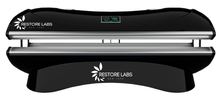 A black and silver Restore Labs UV sterilizer device with digital display on top, used for sterilizing items.