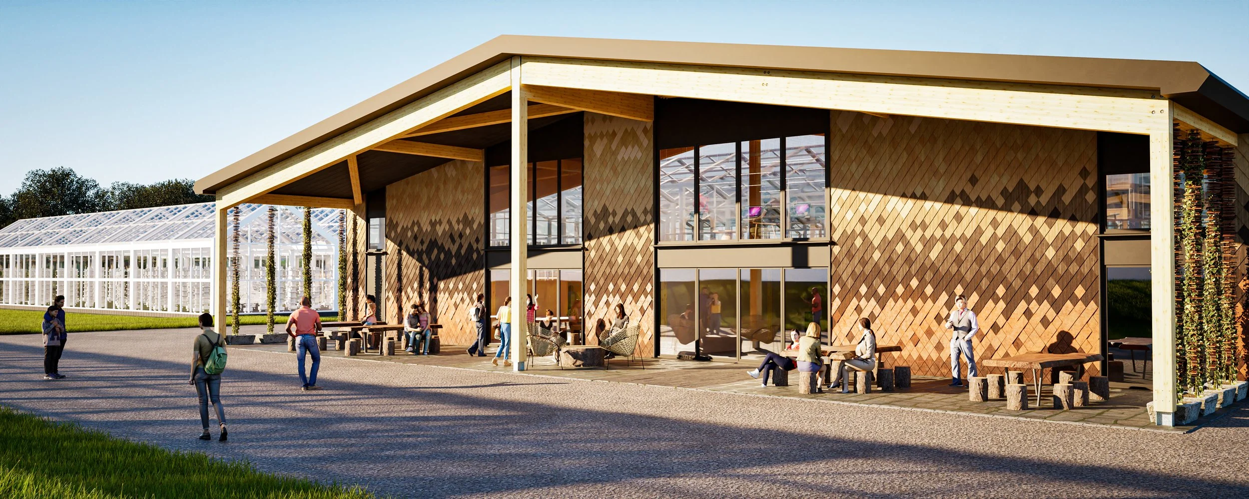 Modern building with wooden facade and large glass windows, surrounded by people socializing outdoors, greenhouses in the background, and clear sky overhead.