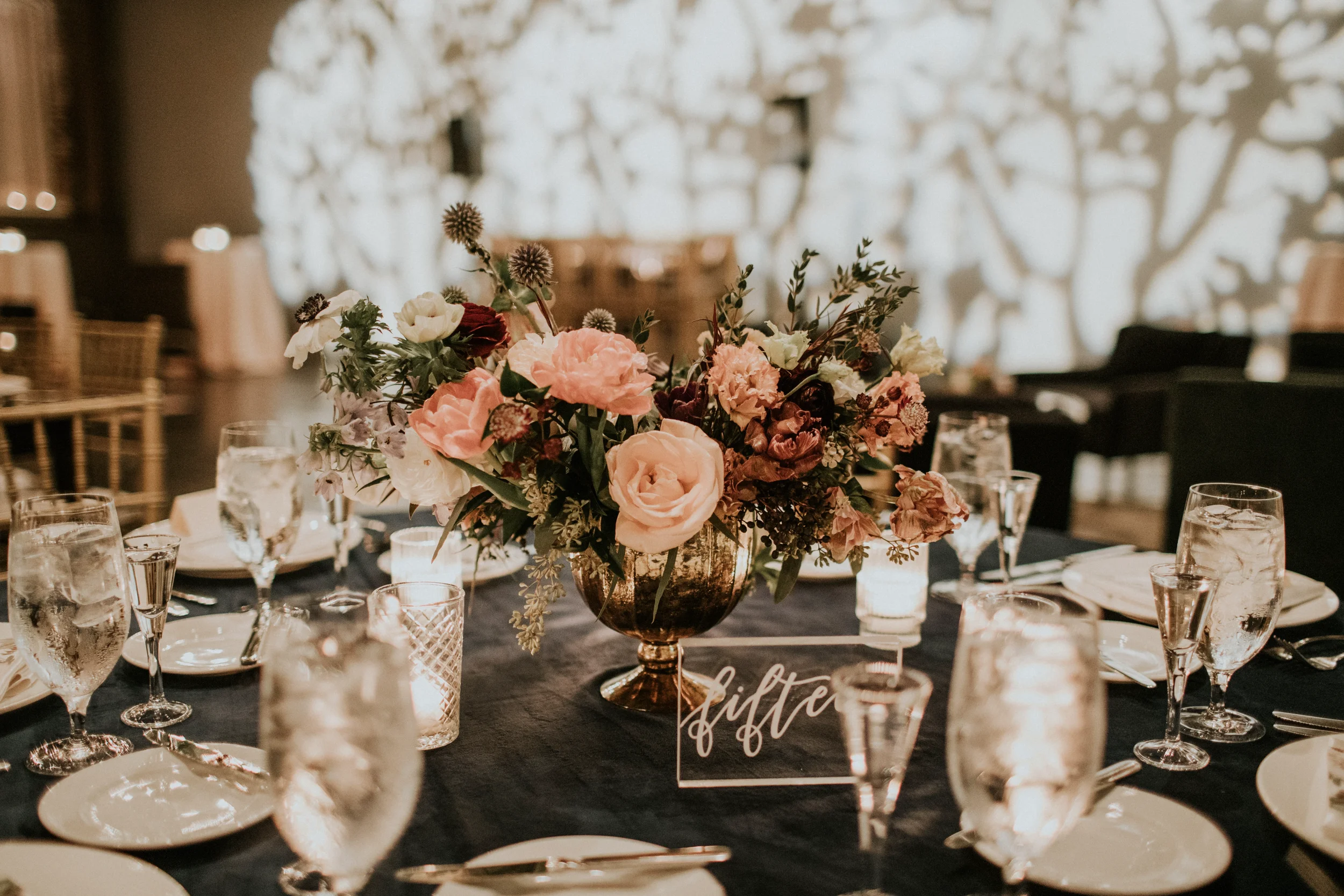 Custom acrylic wedding table numbers for a moody and romantic industrial wedding.