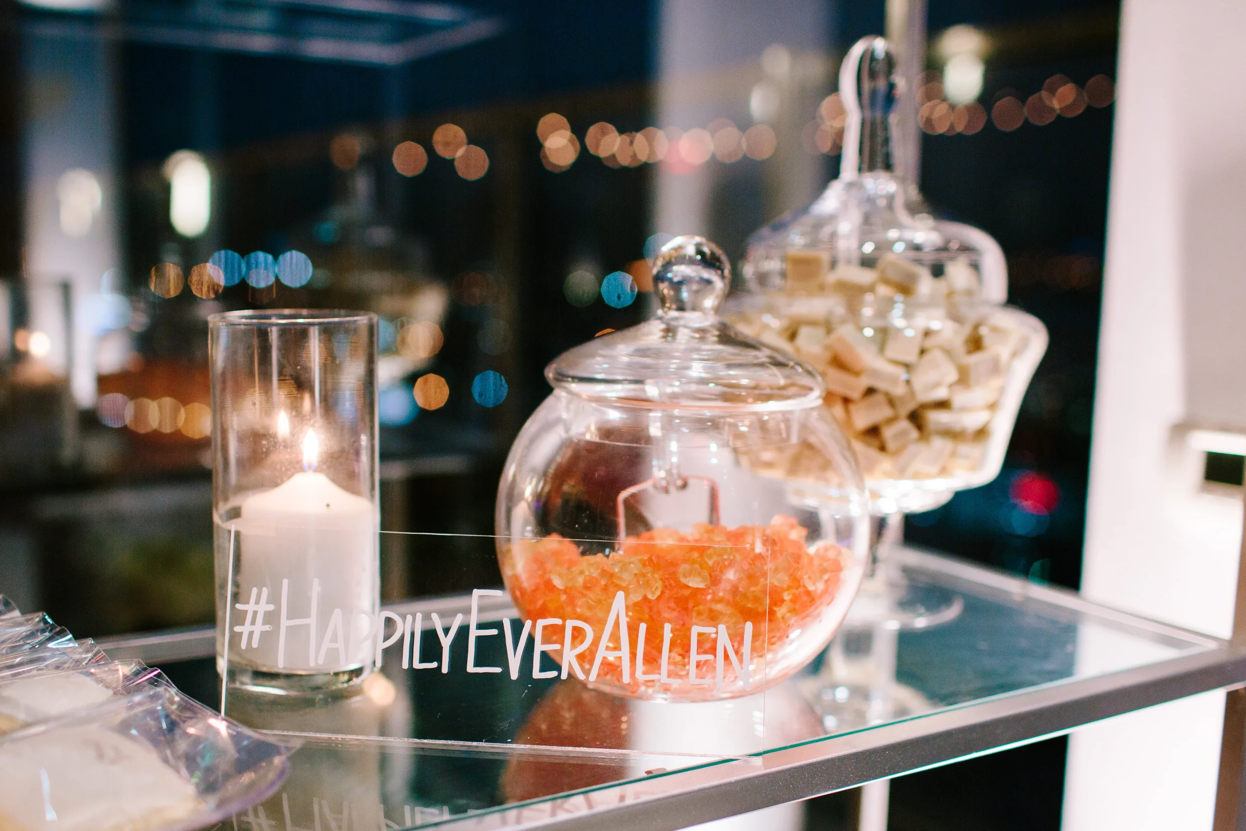 Custom hand-lettered clear acrylic wedding hashtag sign for a modern luxury style wedding.
