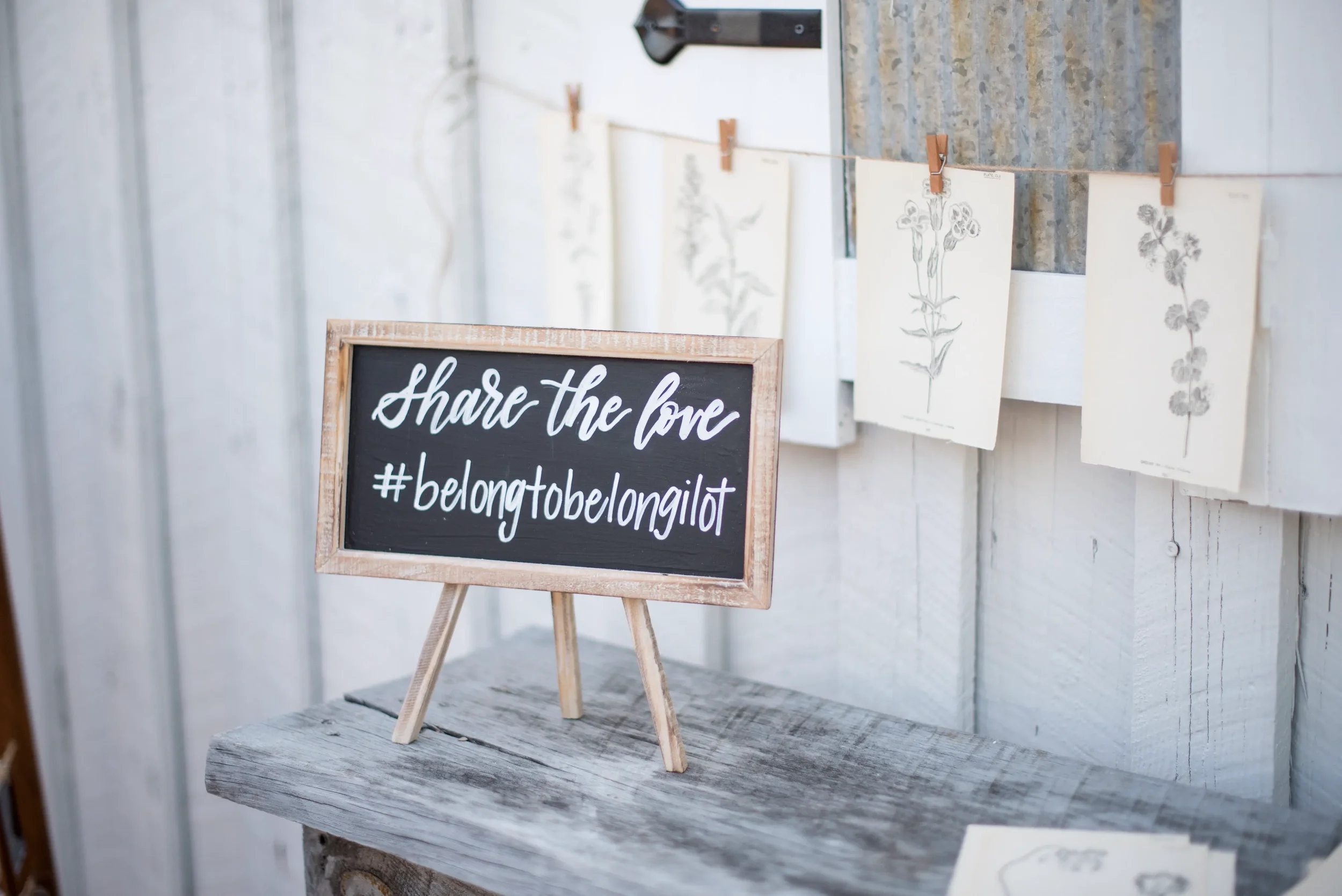 Hand-lettered hashtag chalkboard sign for a rustic outdoor wedding in Georgia.