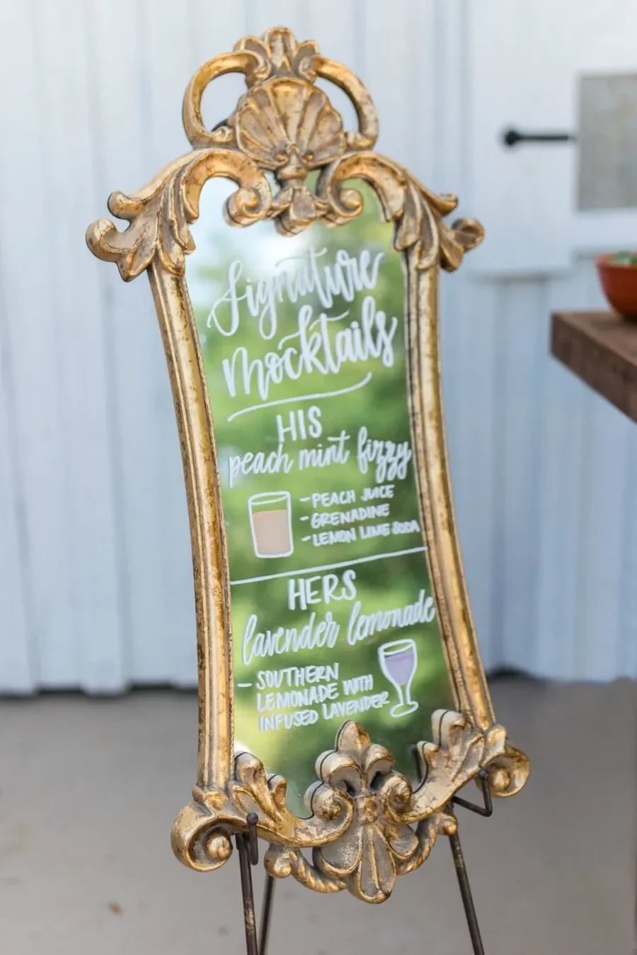 Dress up your beverage station or bar area with a gorgeous hand-lettered vintage gold mirror menu sign. Complete with elegant script lettering and simple cocktail illustrations, it’s a brilliant way to showcase your signature wedding drinks.