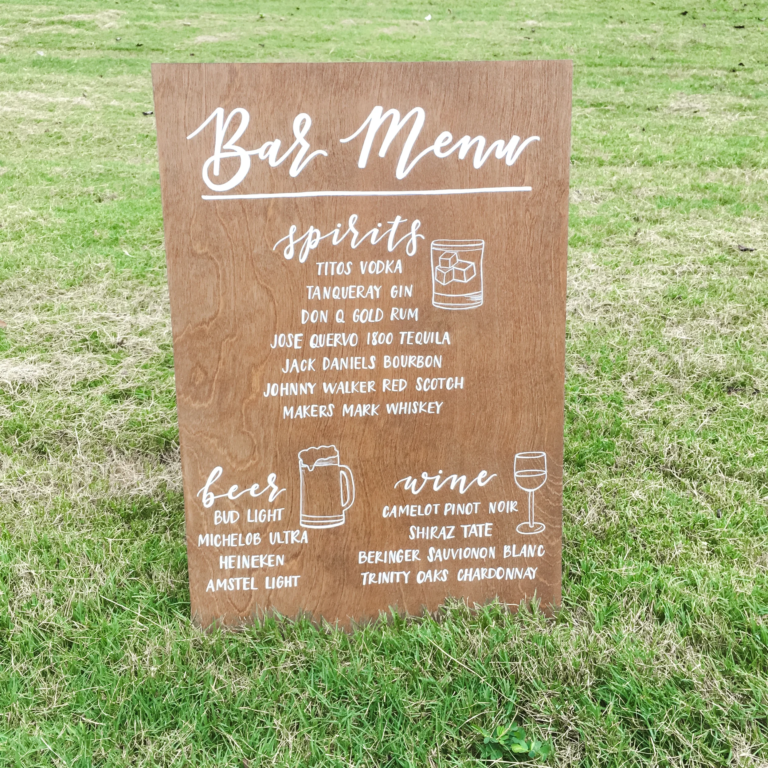 Stained wood bar menu sign listing beer, wine, and spirits options with simple white line illustrations.