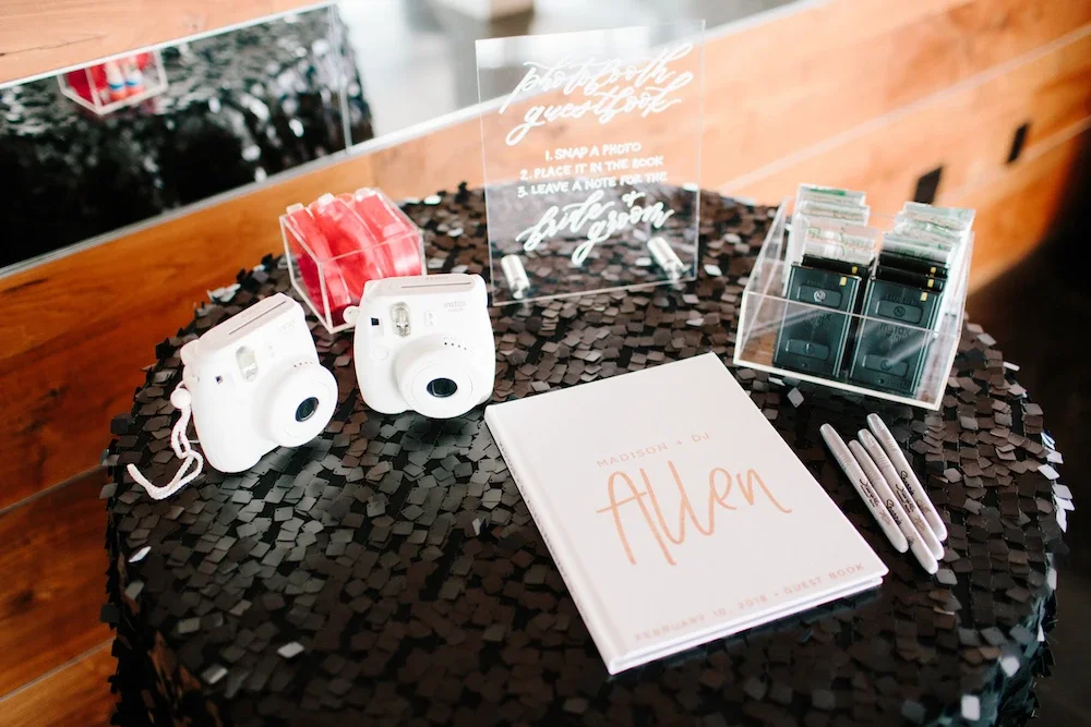 Modern clear acrylic photo booth guestbook sign for a luxury city wedding.