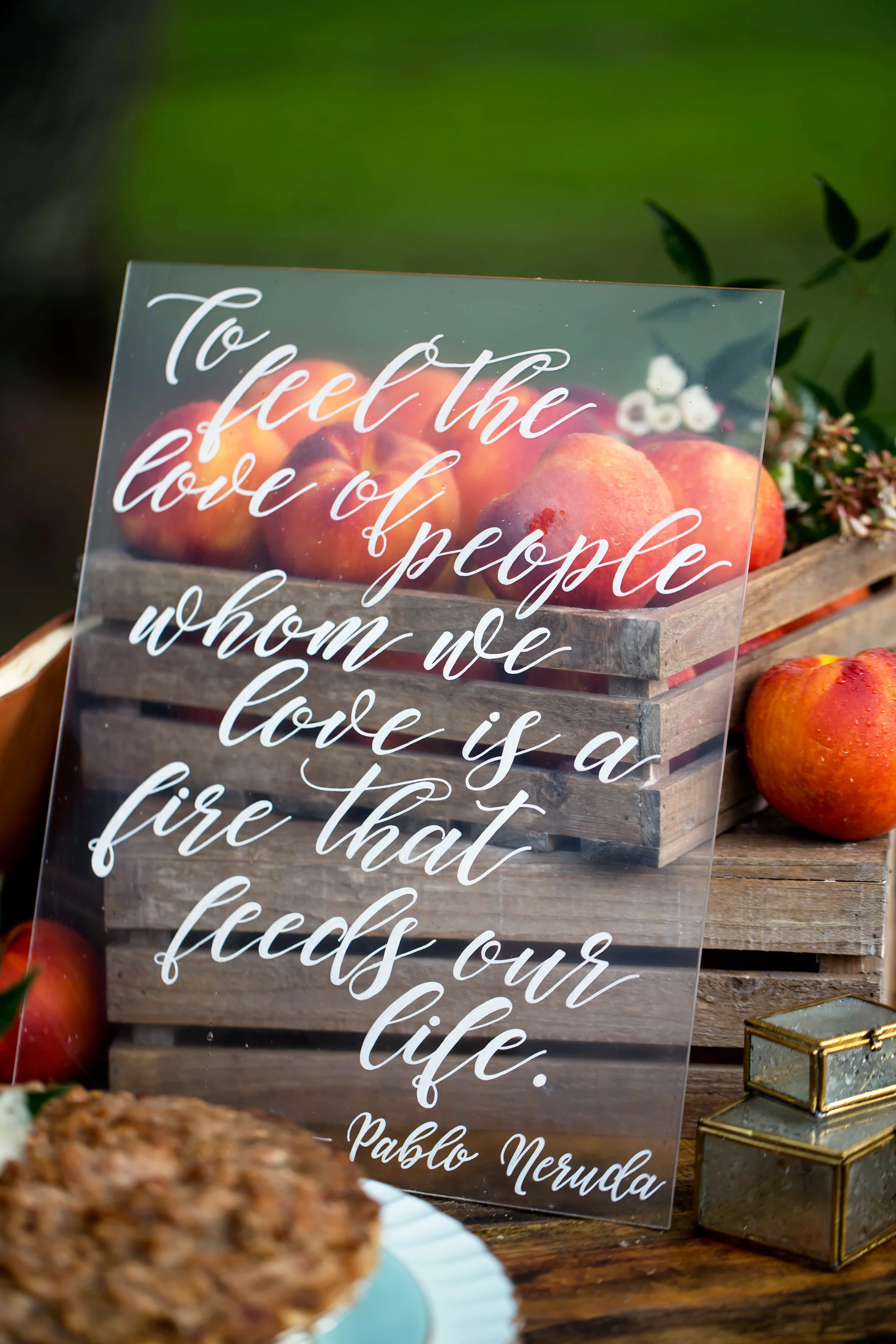 Clear acrylic featuring a custom quote in white hand-lettered calligraphy.