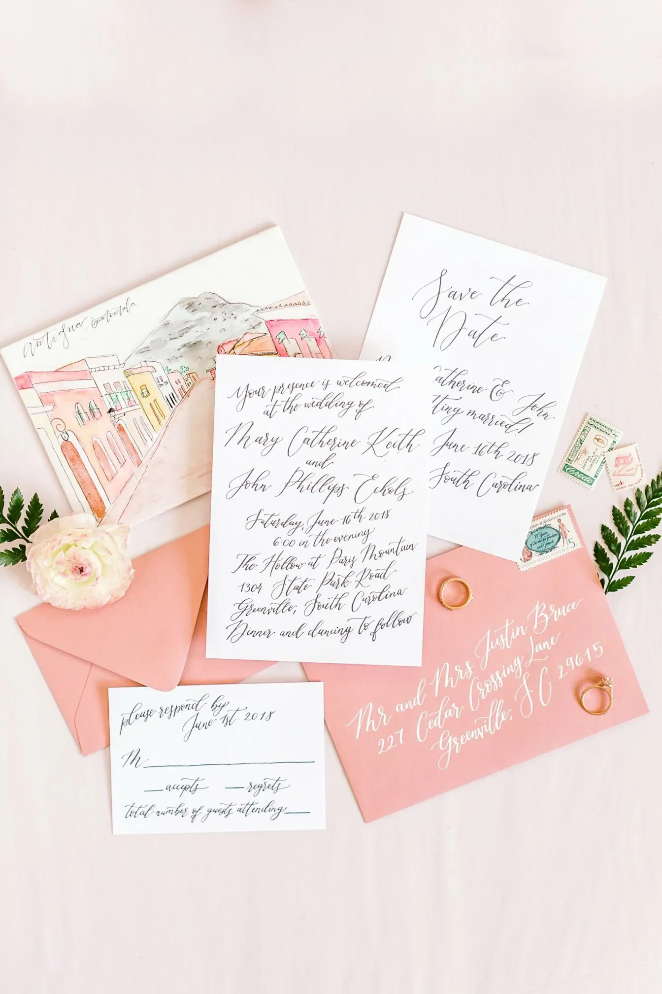 Coral pink watercolor wedding invitation suite with a custom hand-painted destination venue illustration card.